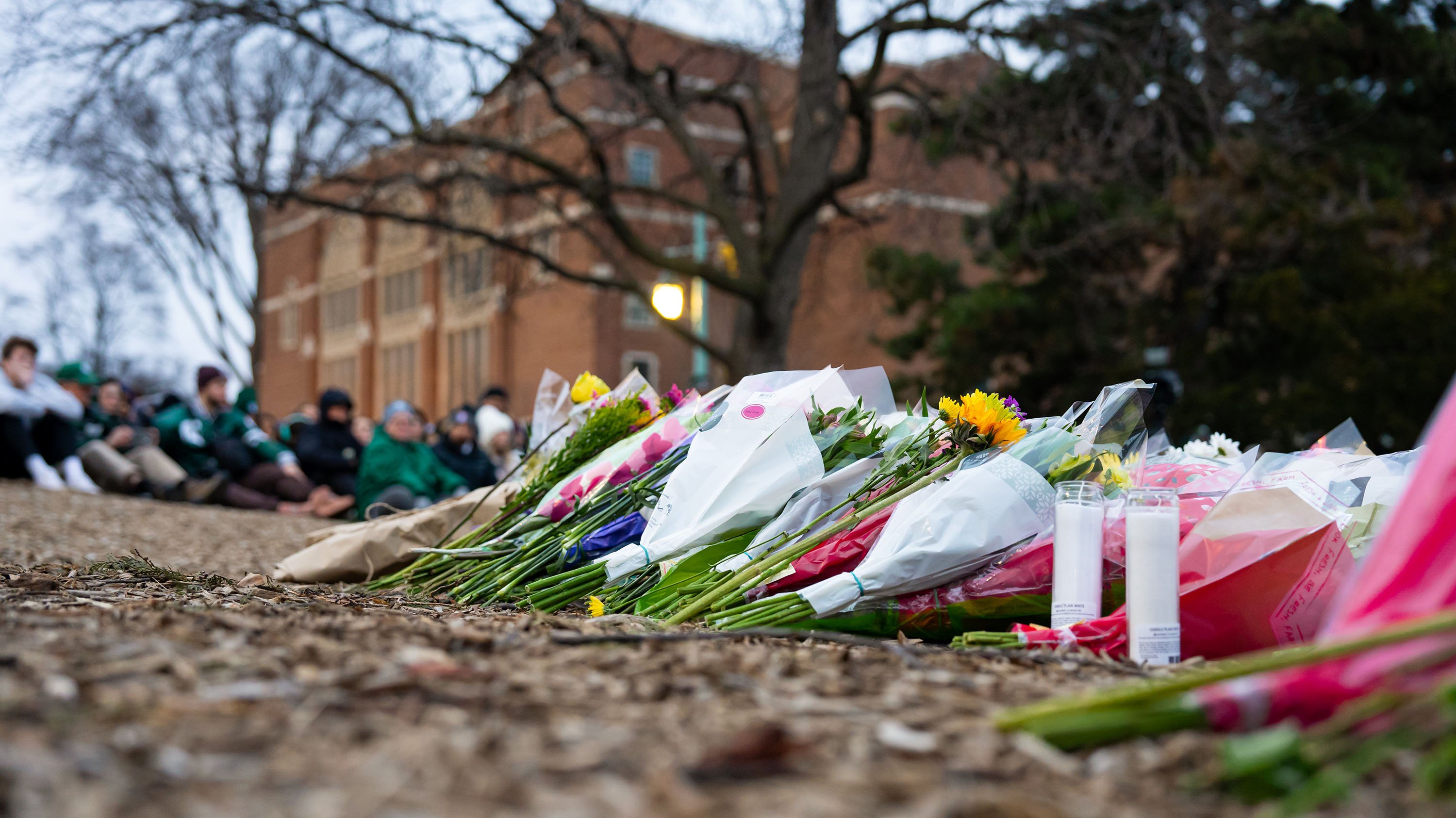Flowers laid in front of the Rock at vigil