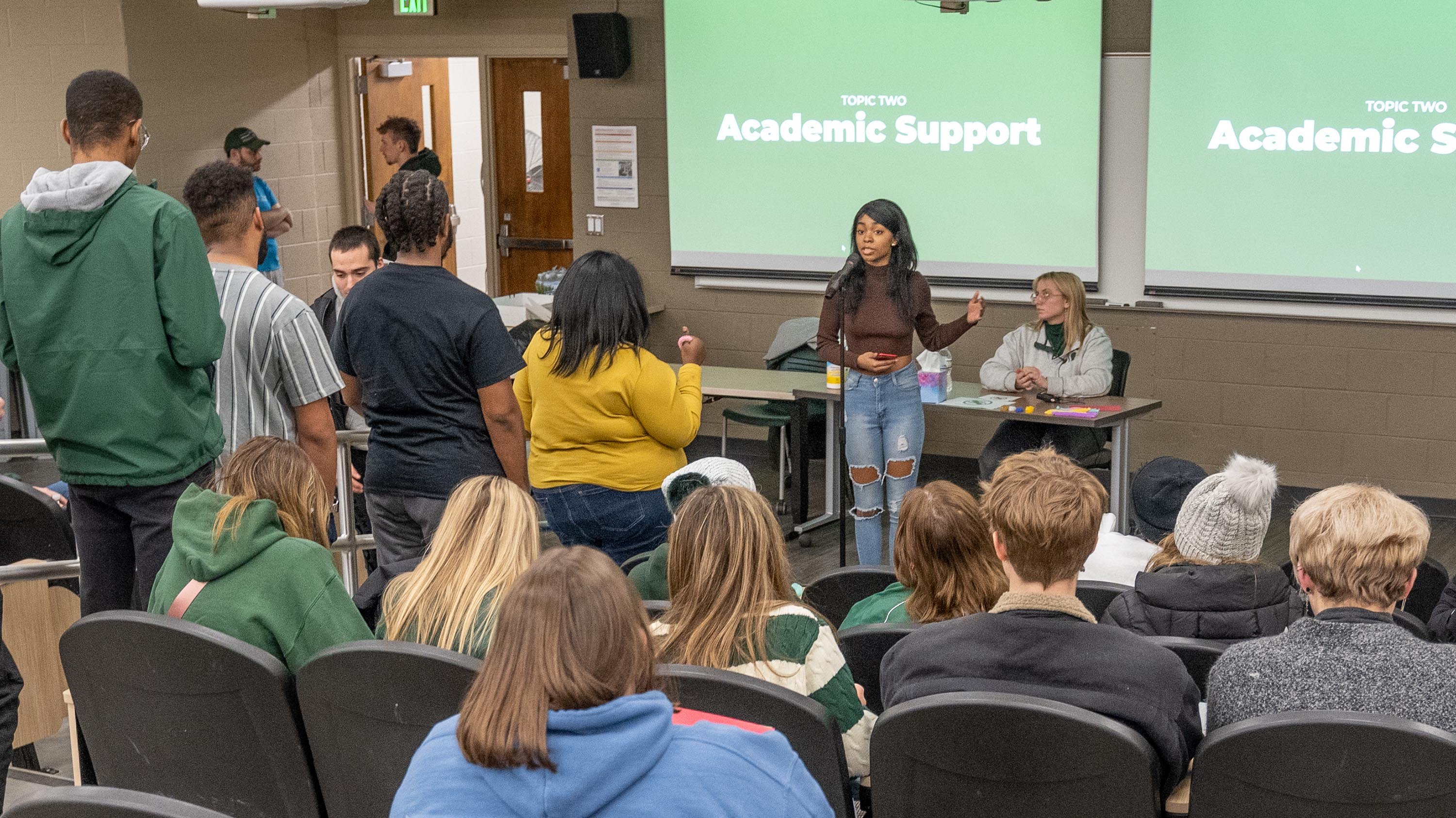 Students standing in line to speak at town hall