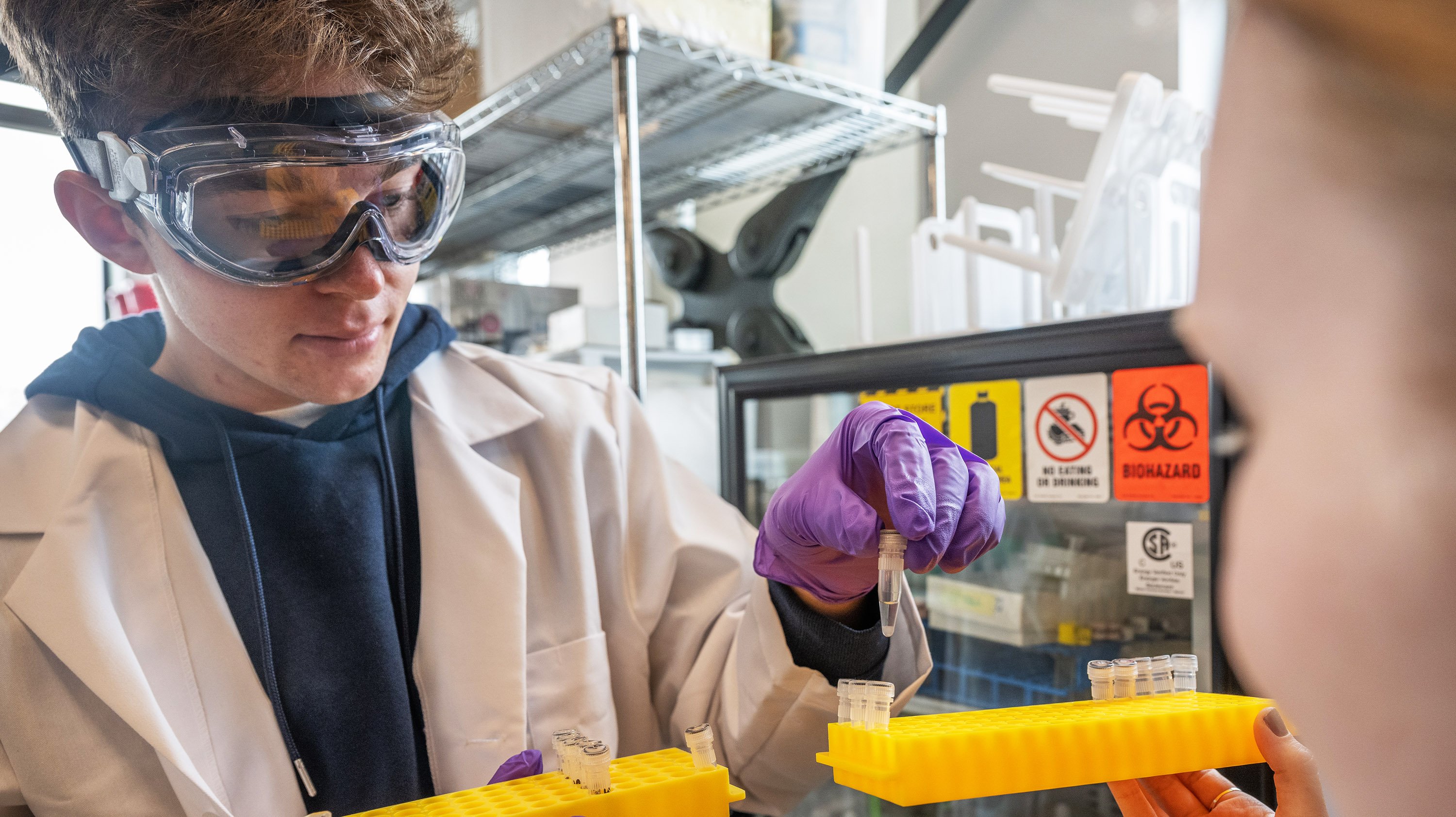 Students using pipette in experiment