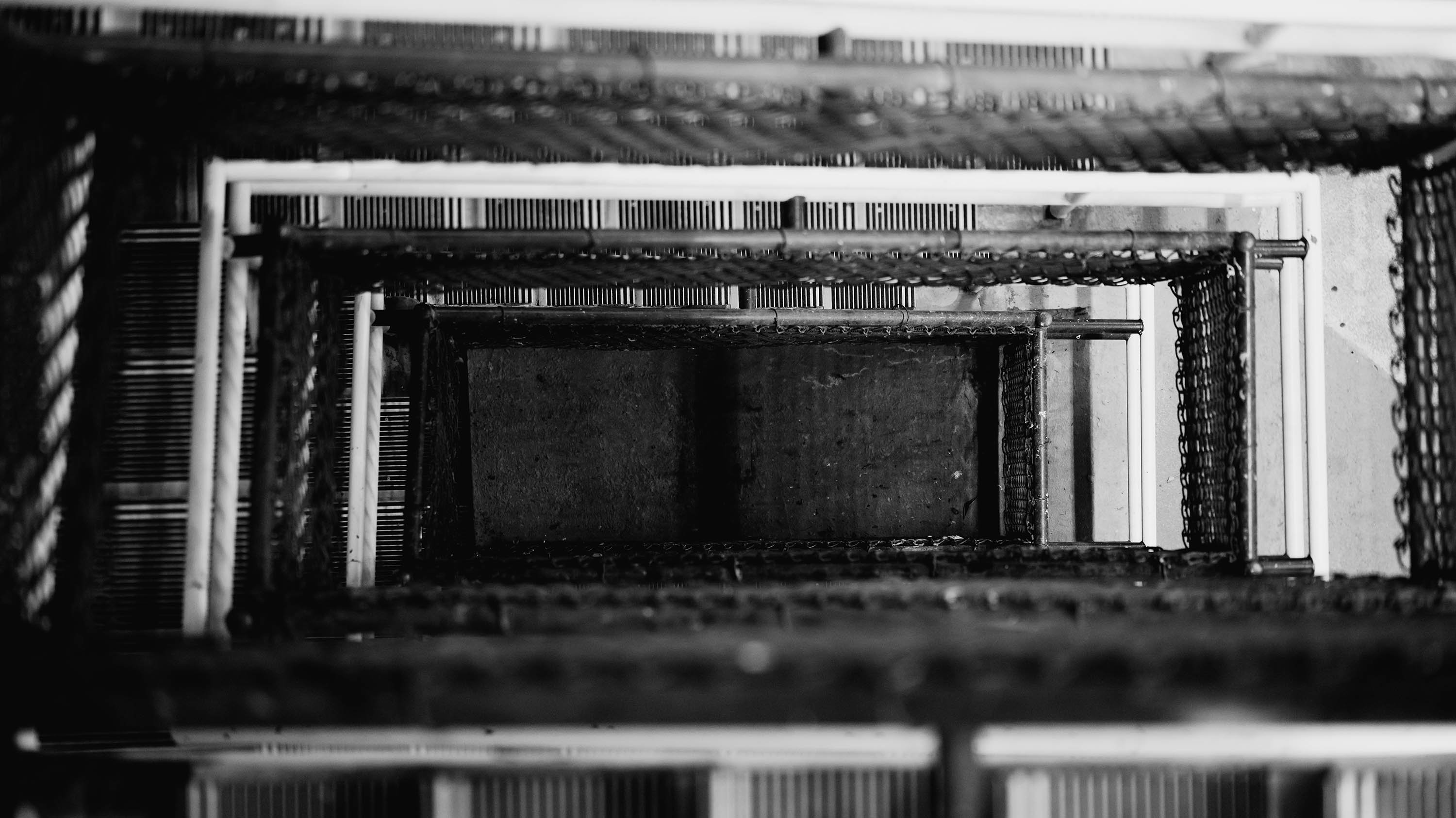 Black and white image of the admin parking ramp seen from above