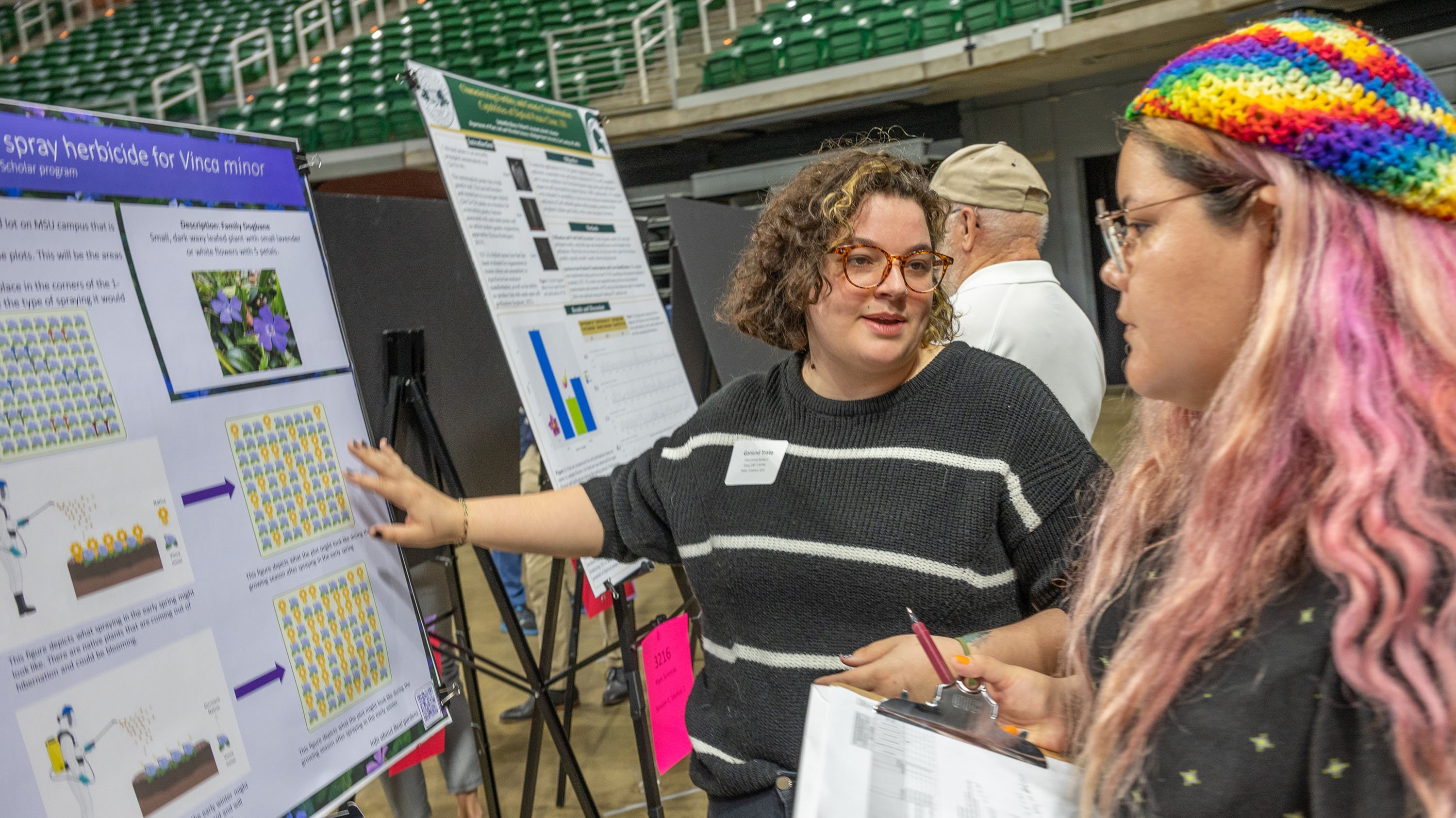 Student presenting work to judge at UURAF