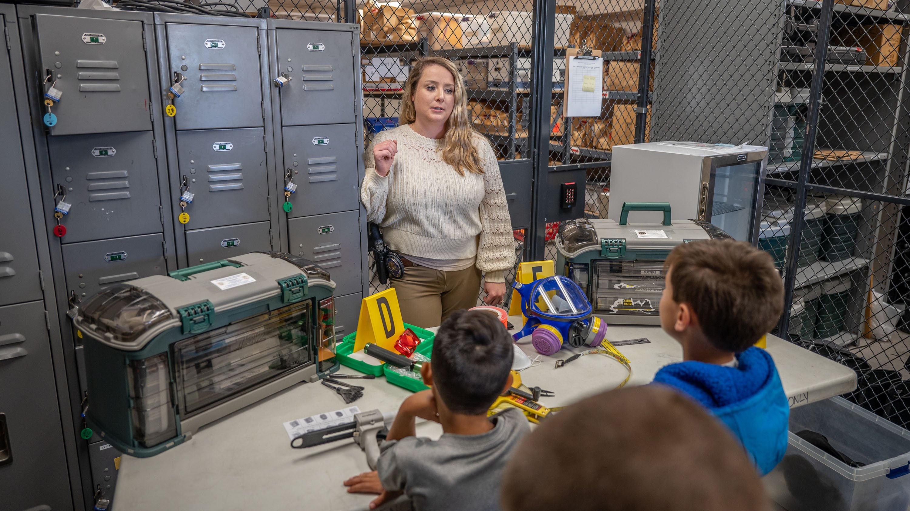 Children looking at evidence department during take your child to work day