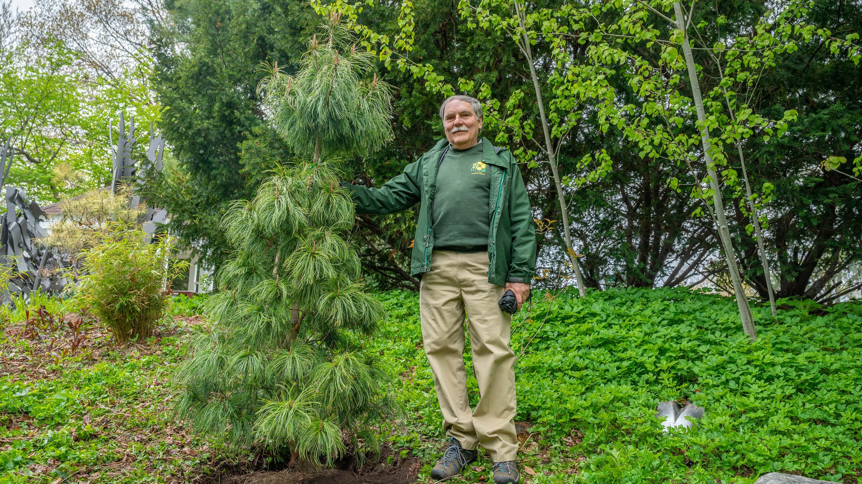 Frank Telewski posing with tree