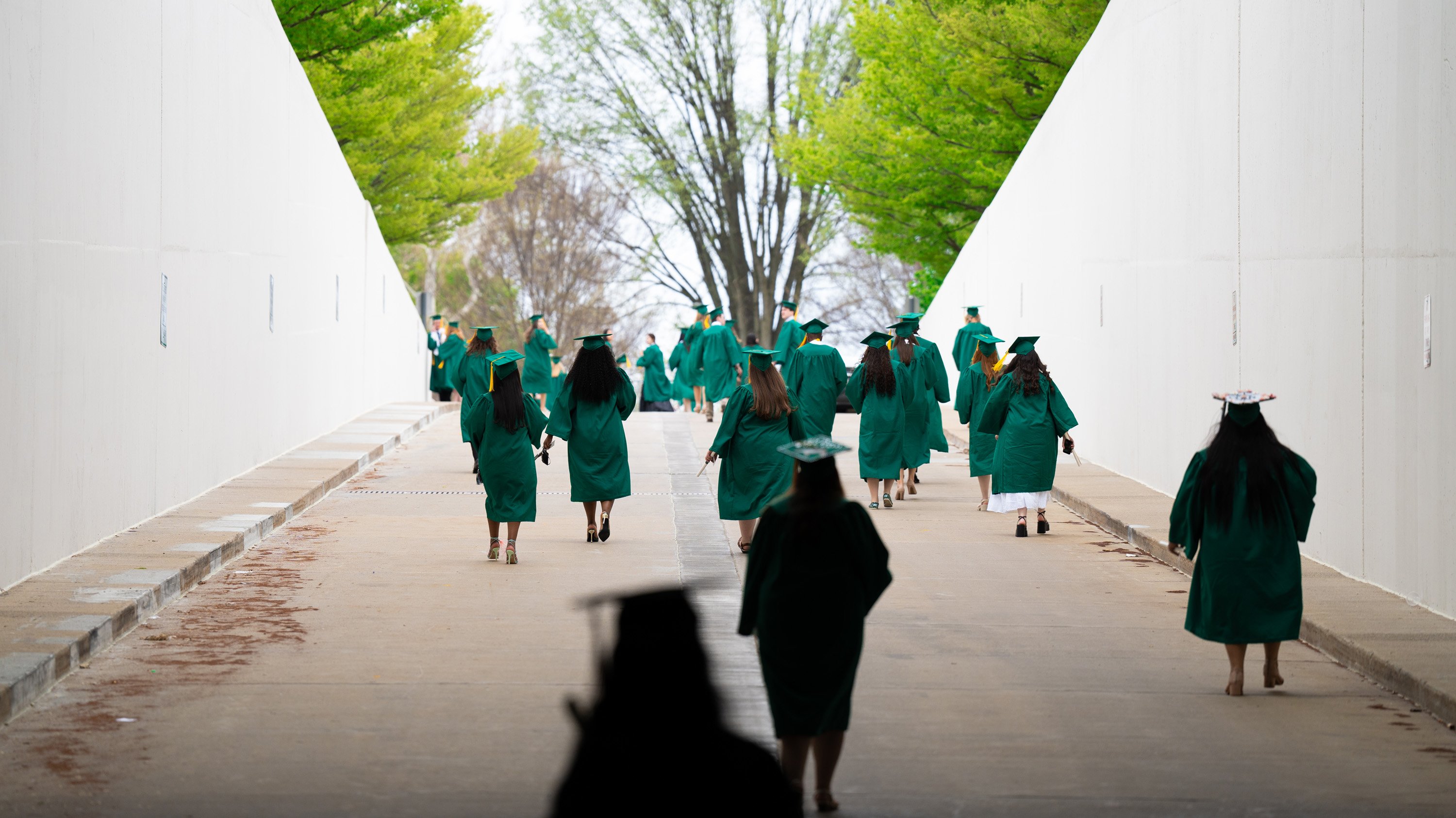 Graduates exiting through Breslin tunnel after ceremony