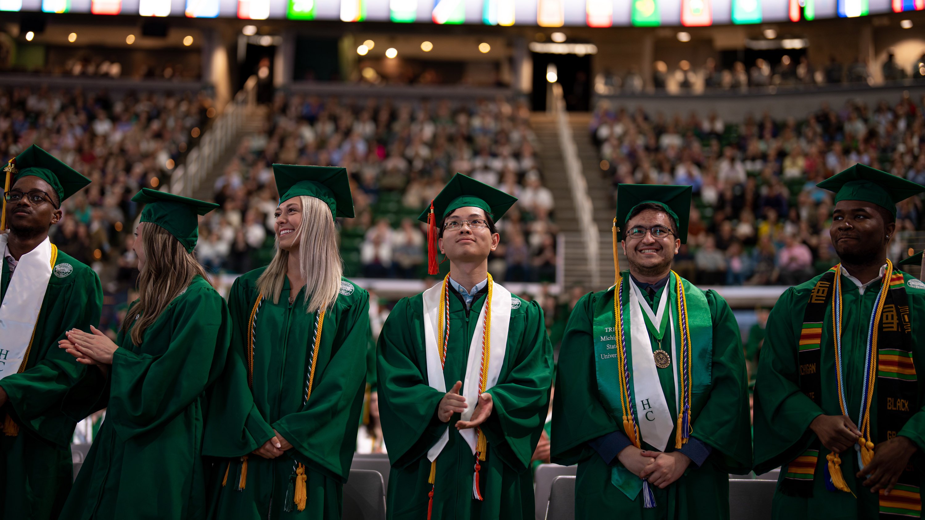 Graduates in caps and gowns at commencement ceremony