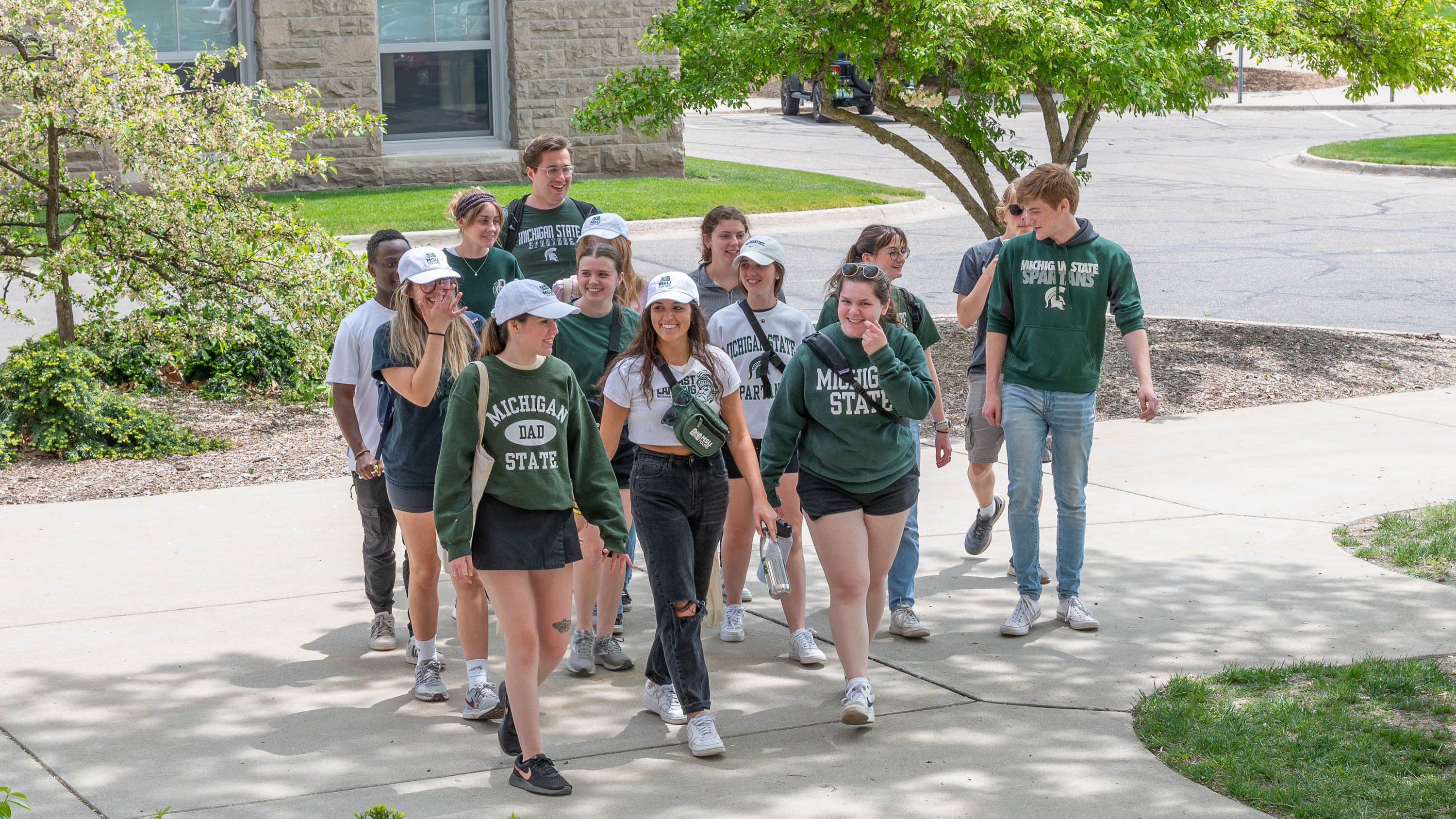 MSU tour guides walking on campus