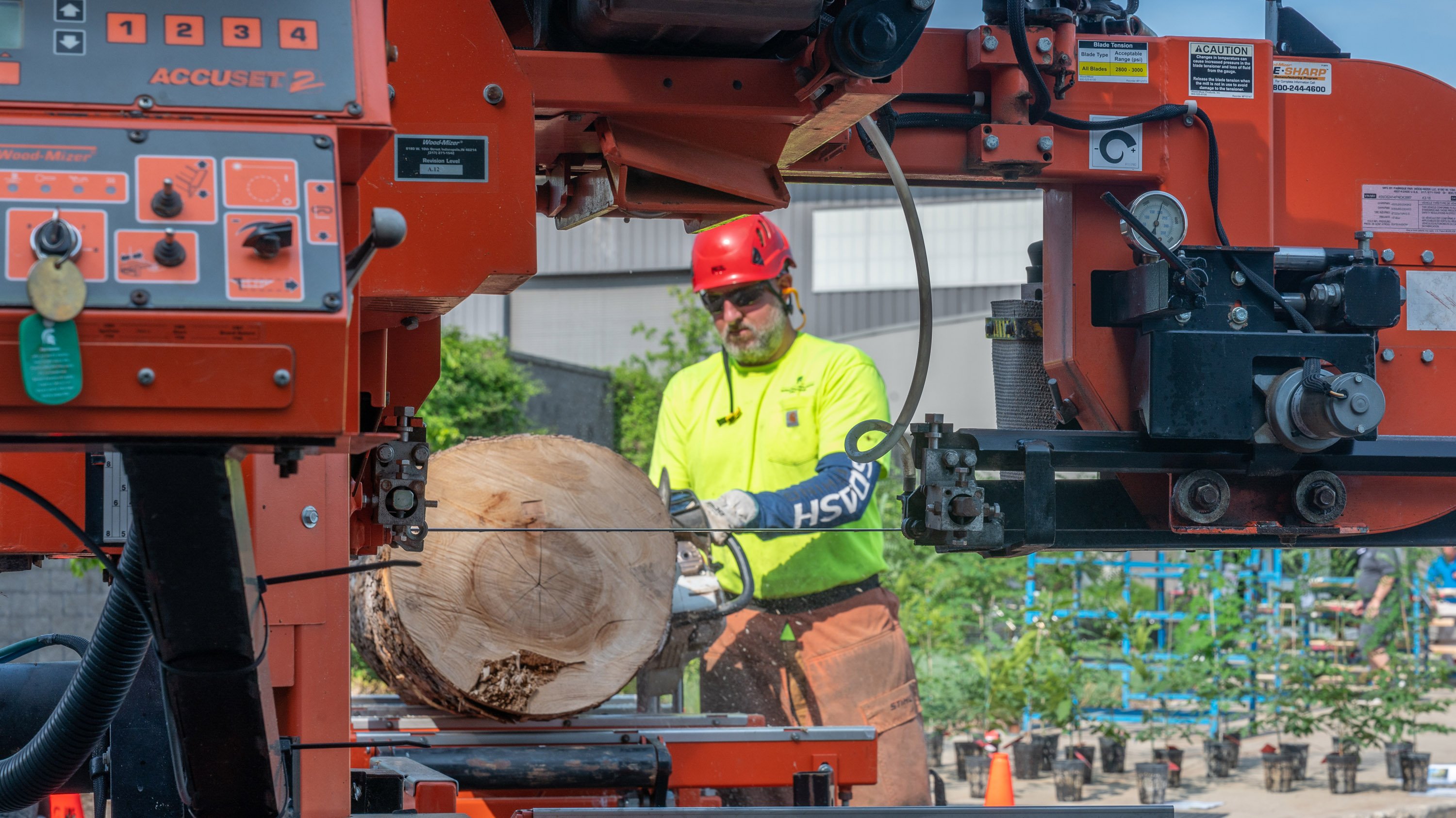 A member of Landscape Services demonstration tree milling equipment