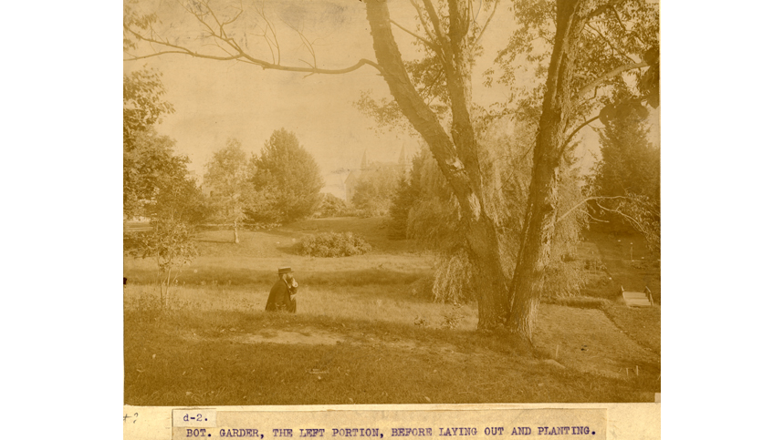 Vintage sepia photograph of a man sitting on the riverbank before the garden was planted