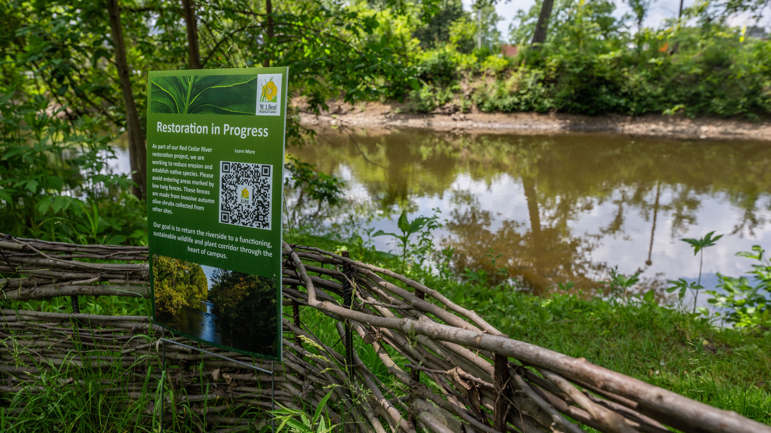 Sign with QR code for Beal river restoration project