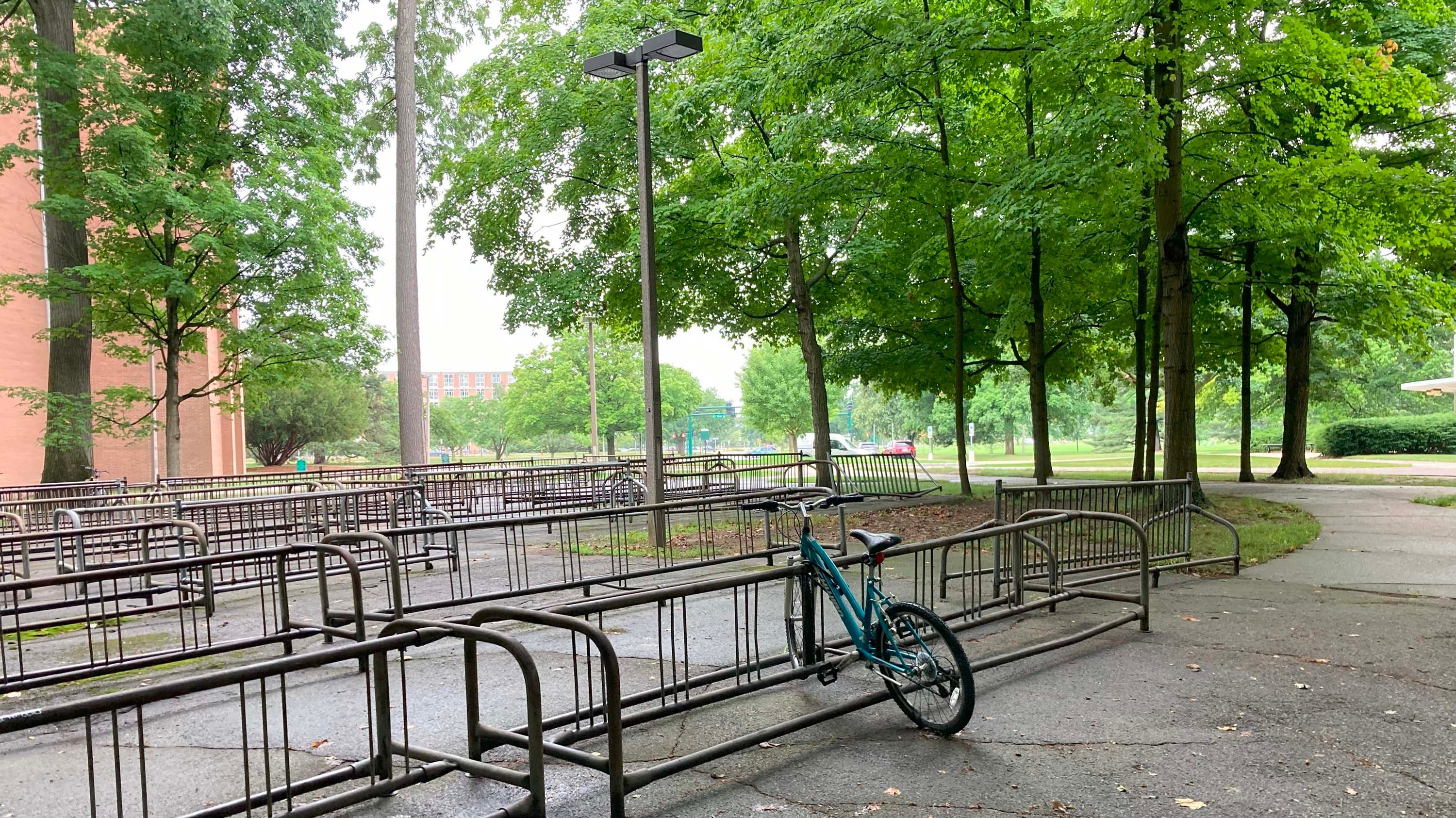 One bike in an otherwise empty bike rack outside McDonel Hall