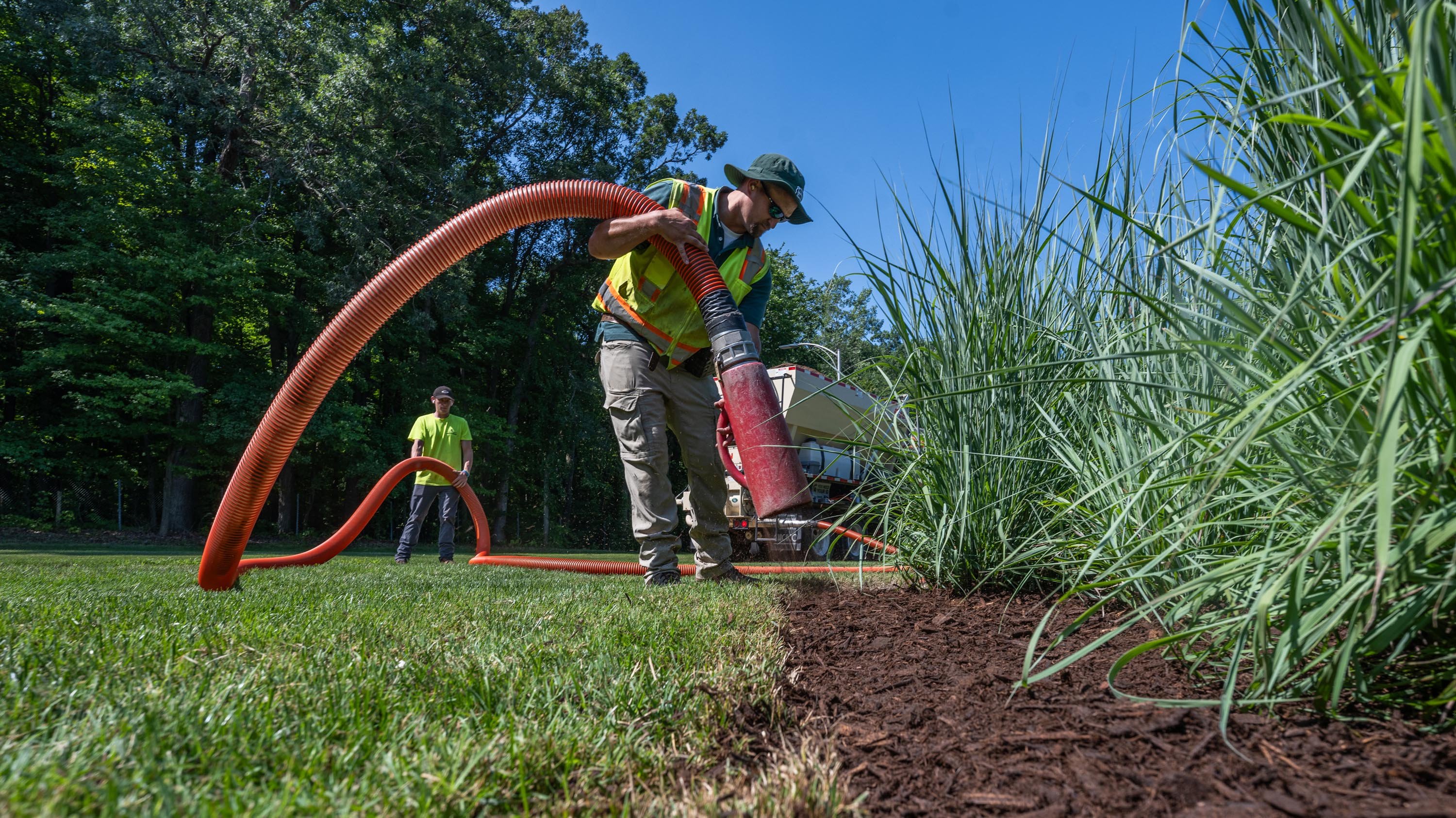 Landscape Services crew adding mulch to garden beds