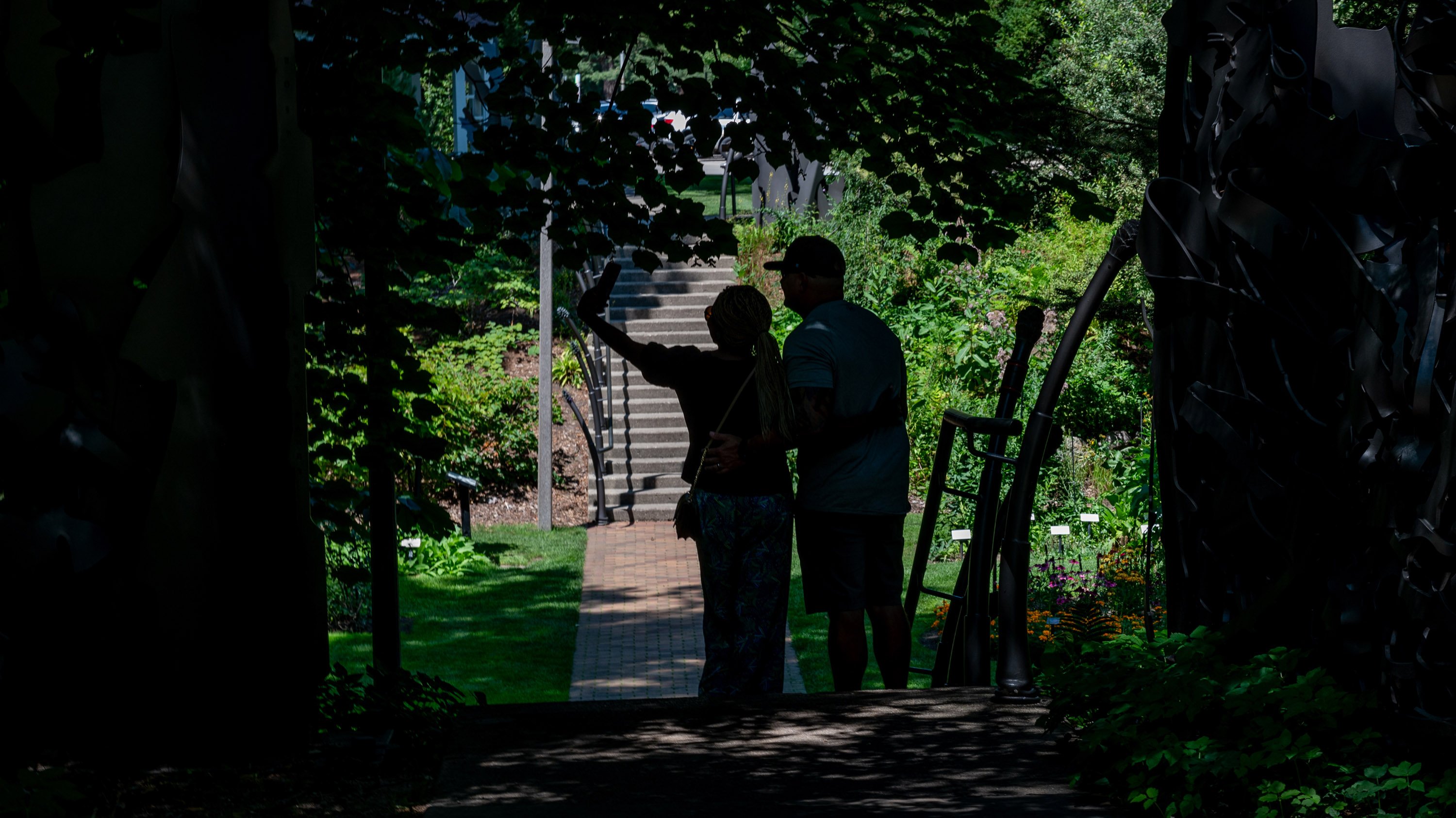Silhouetted couple taking selfie in Beal Garden