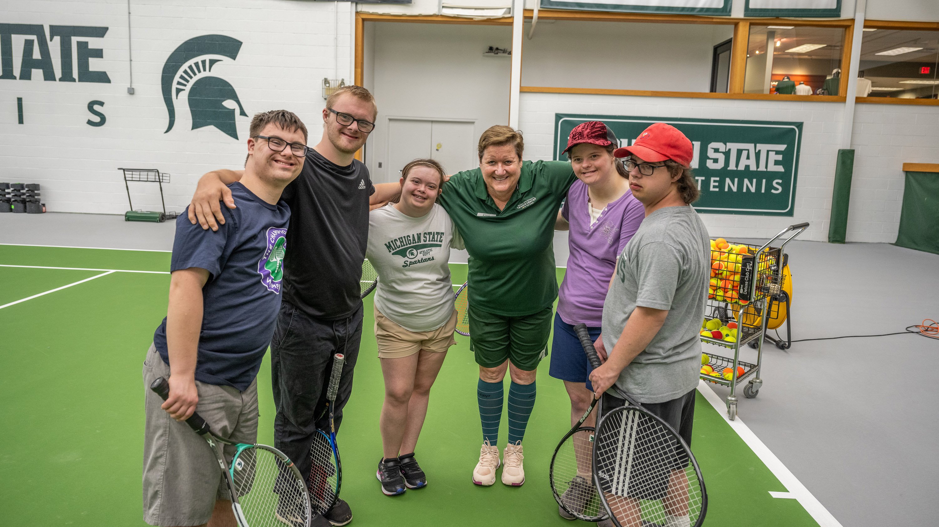 Diane Selke and CADSA members posing for picture at indoor tennis facility
