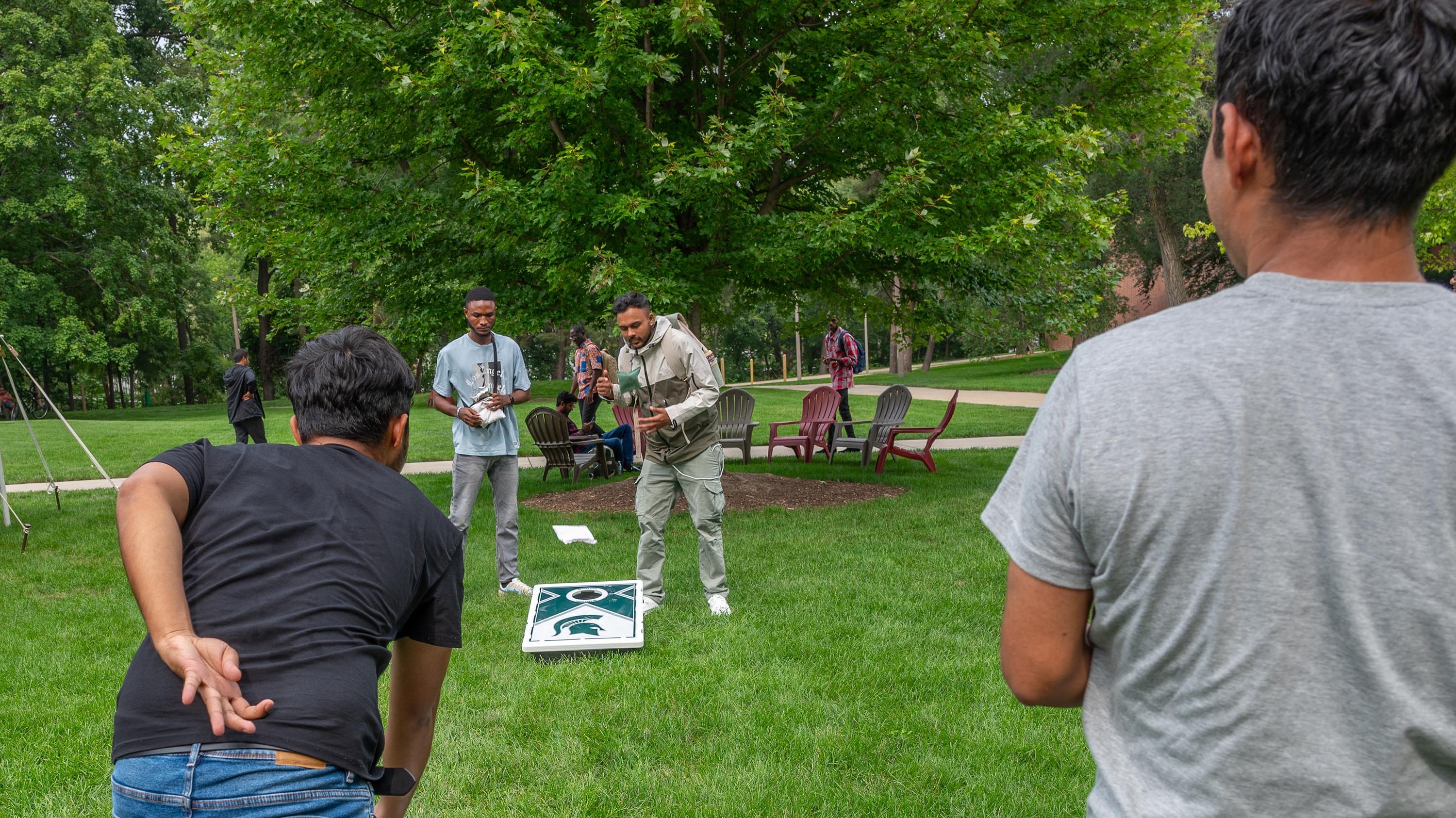 International students playing cornhole