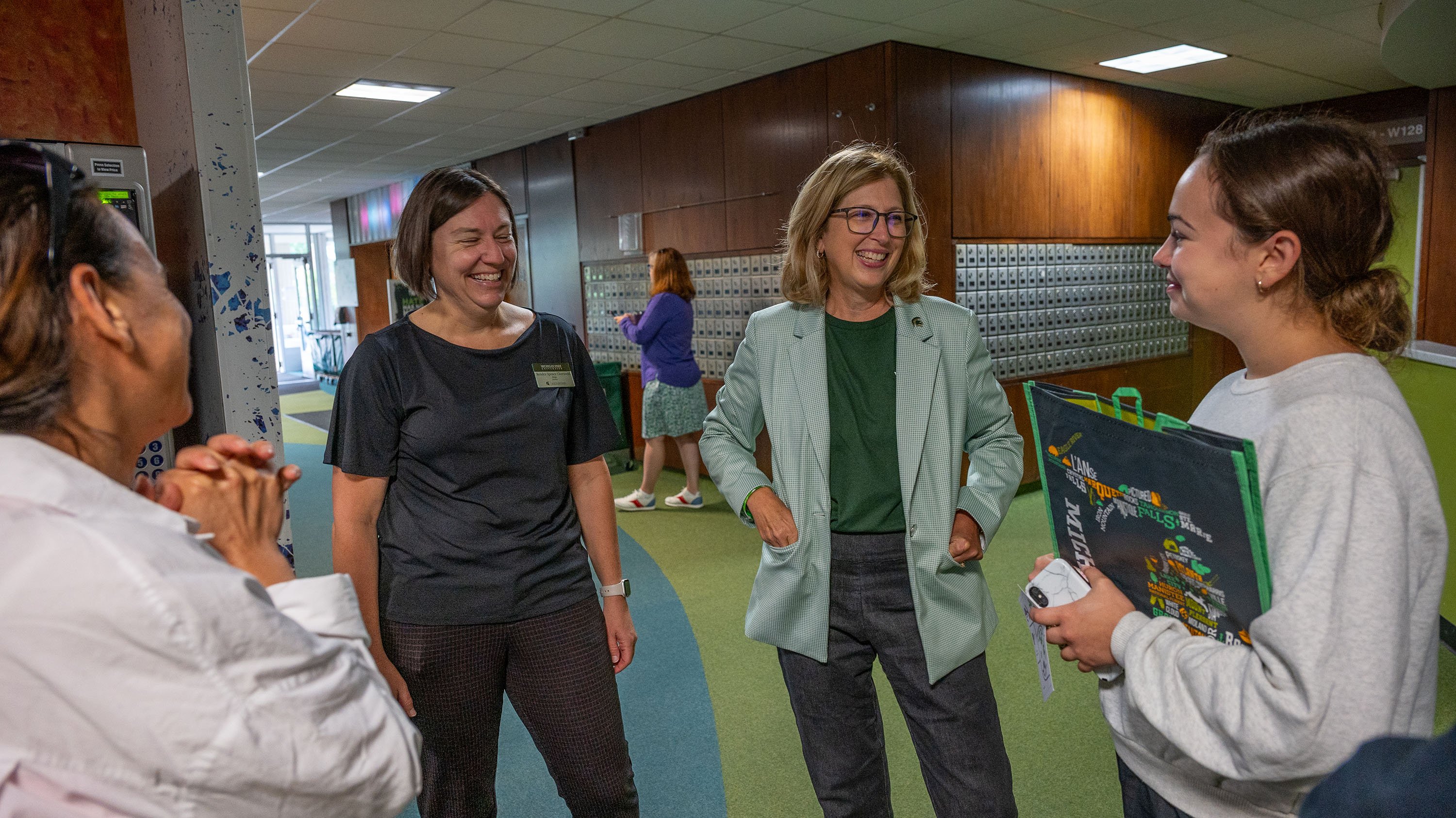 Theresa K. Woodruff with parents and students during residence hall move-in