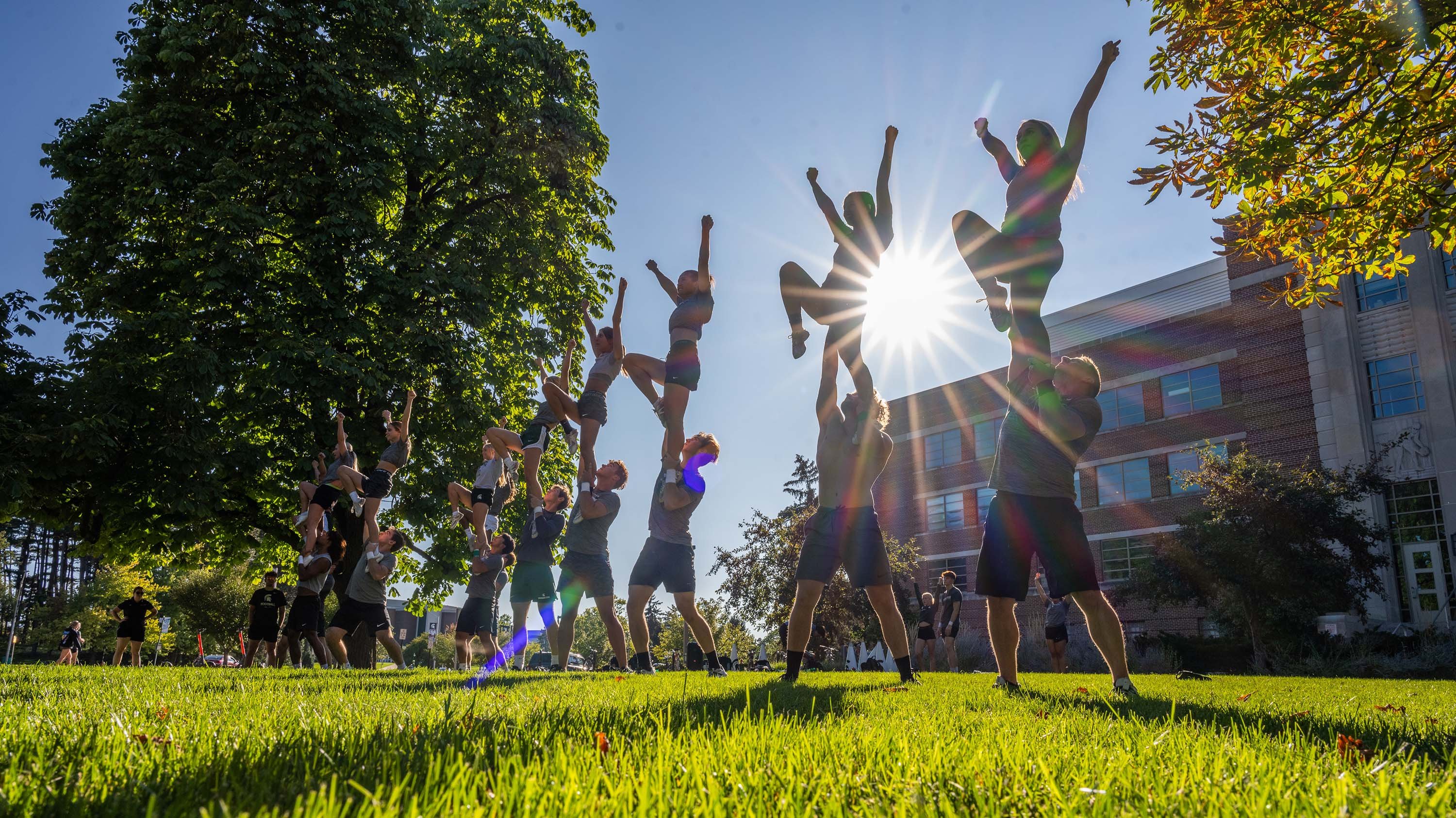 Cheer team practicing outdoors