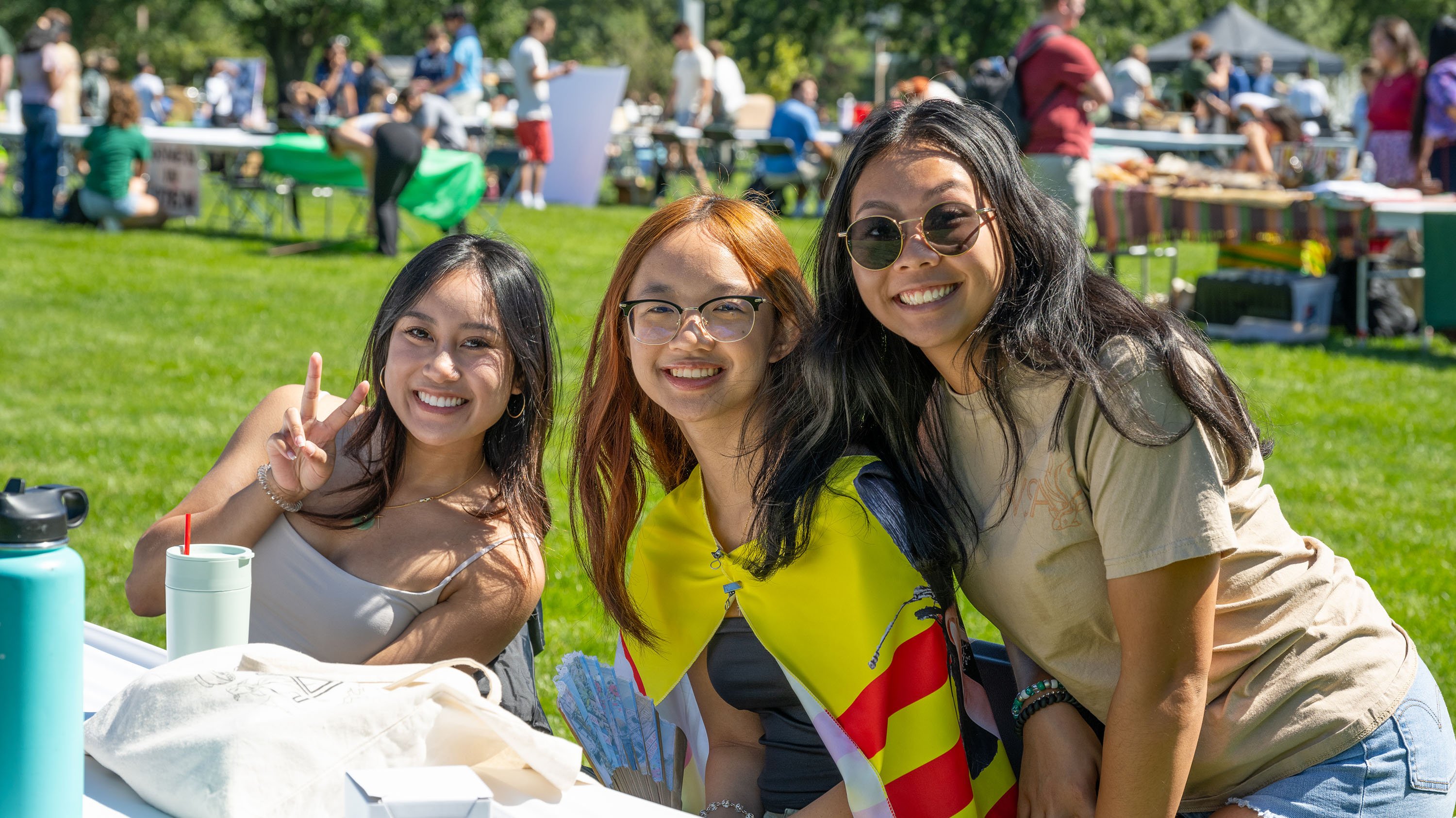 Students posing at a table during Sparticipation