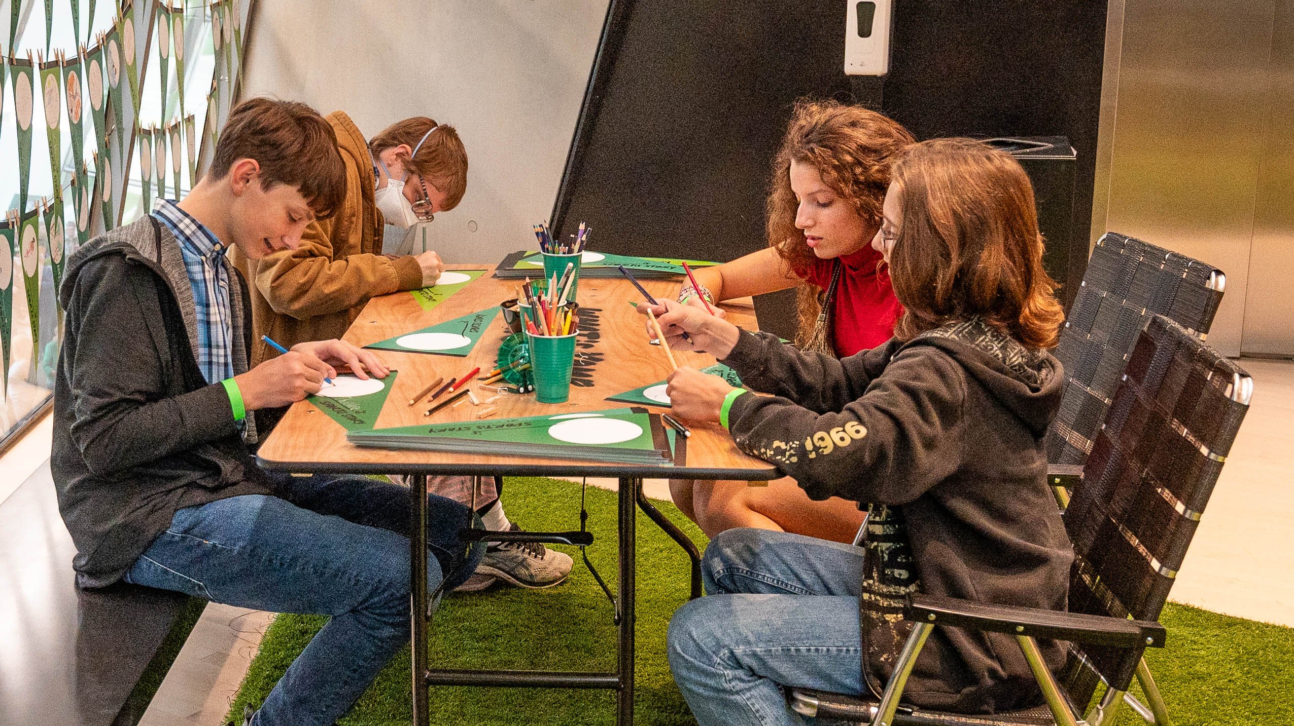 Students at an activity table at the Broad Art Museum fall opening party