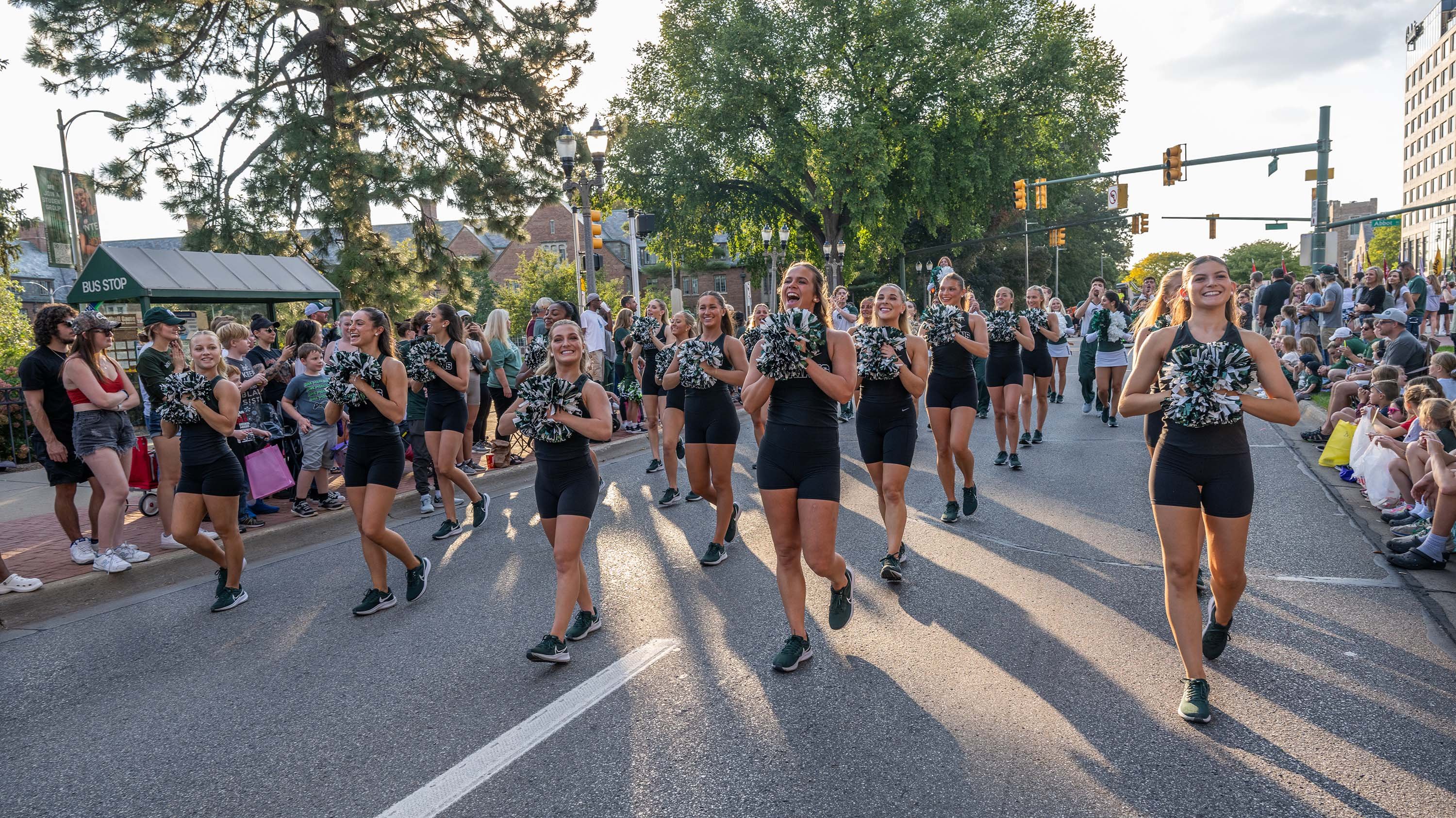 Cheer team walking in homecoming parade