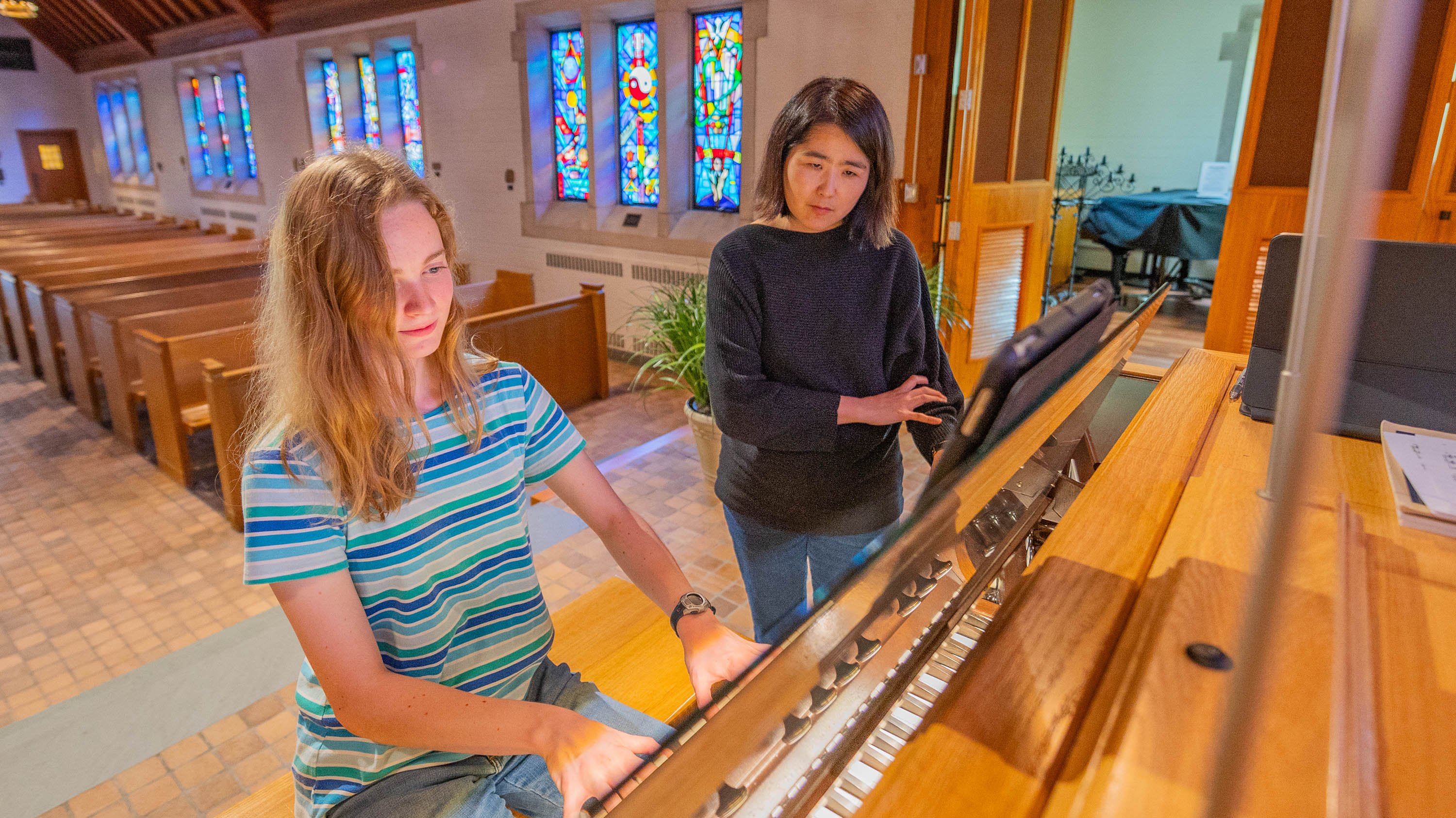 Student and instructor practicing organ in MSU Alumni Chapel
