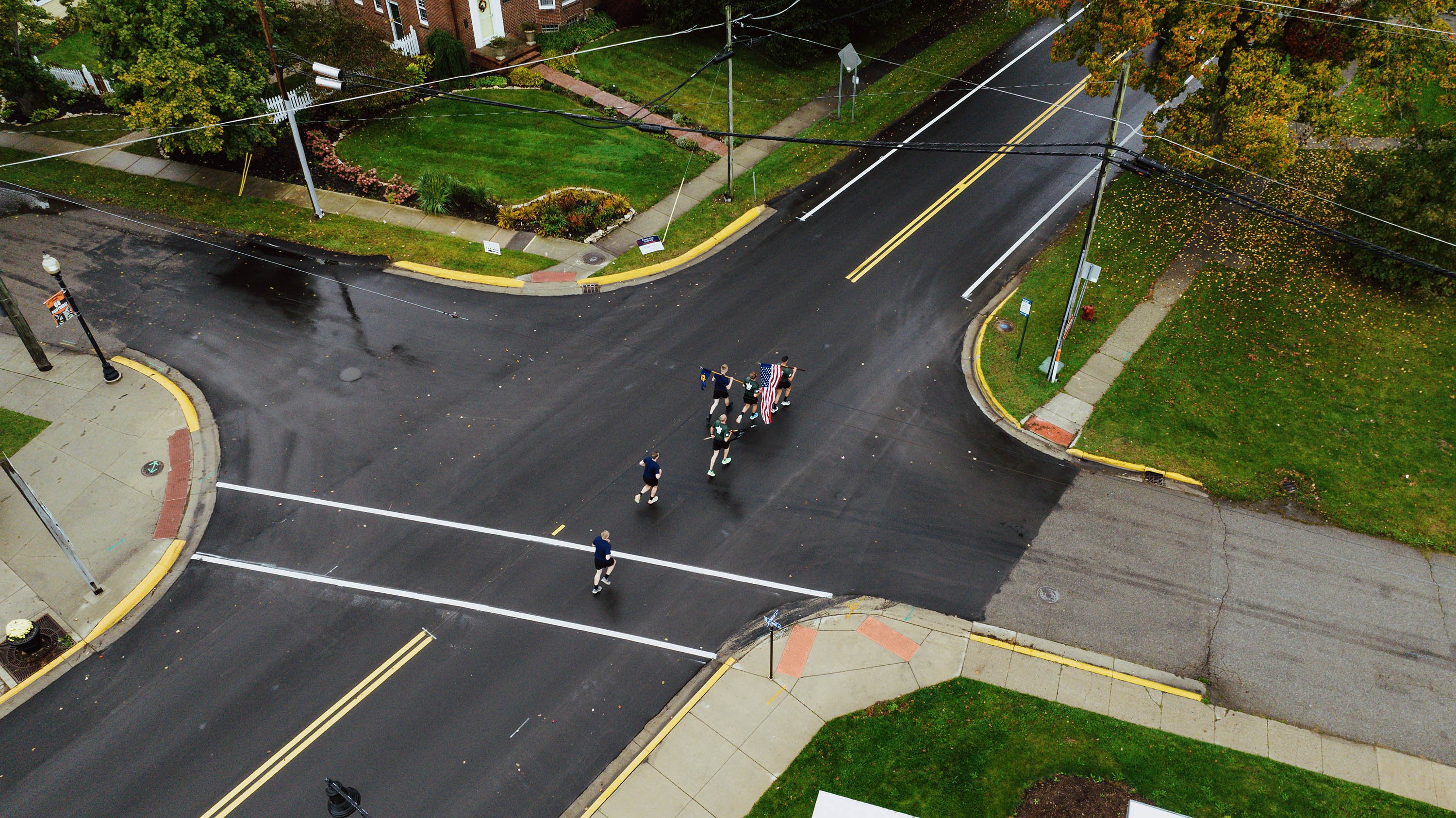 Bird's eye view of racers running through the streets of Ann Arbor during Alex's Great State Race