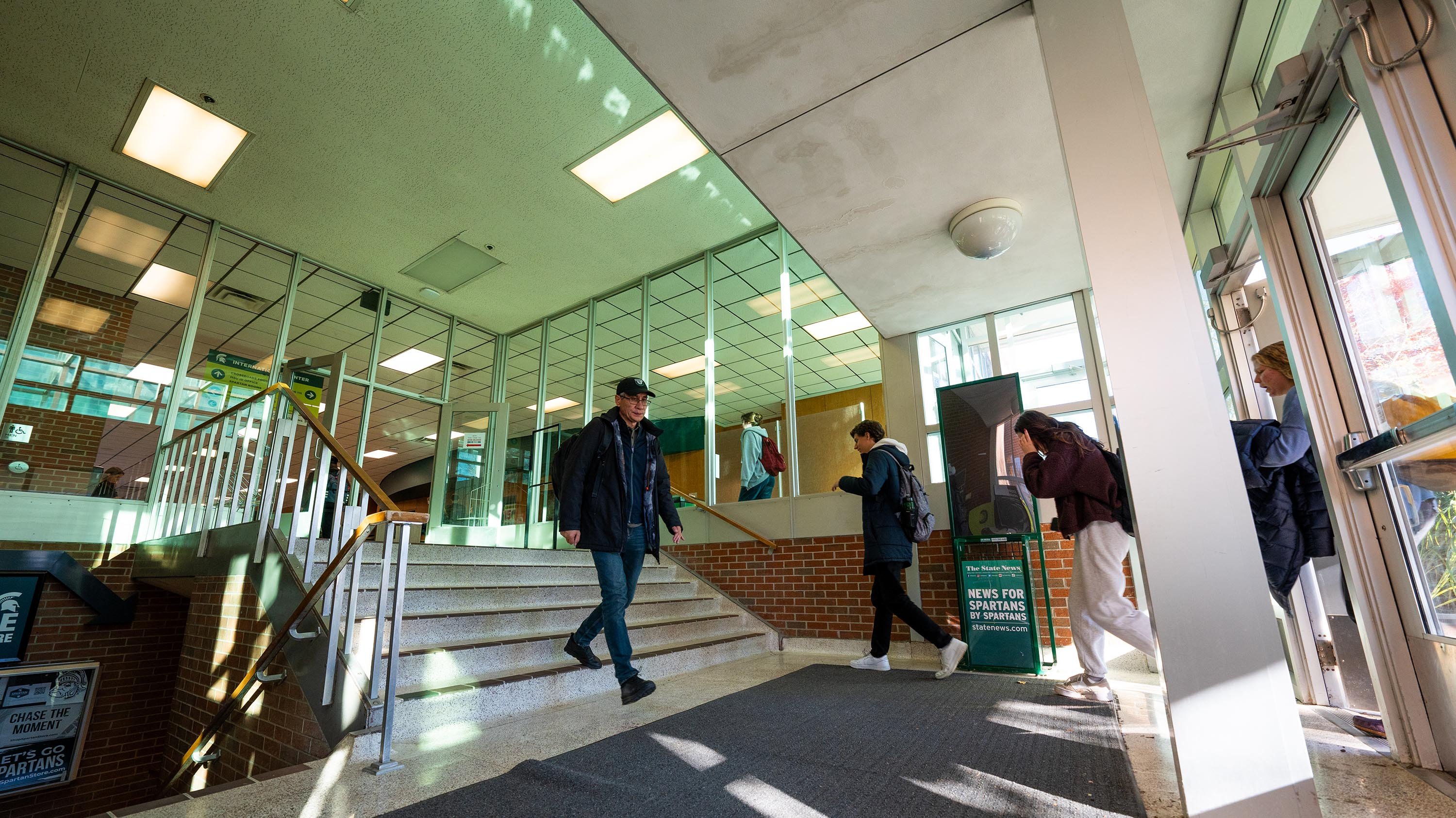 People walking in entrance of International Center