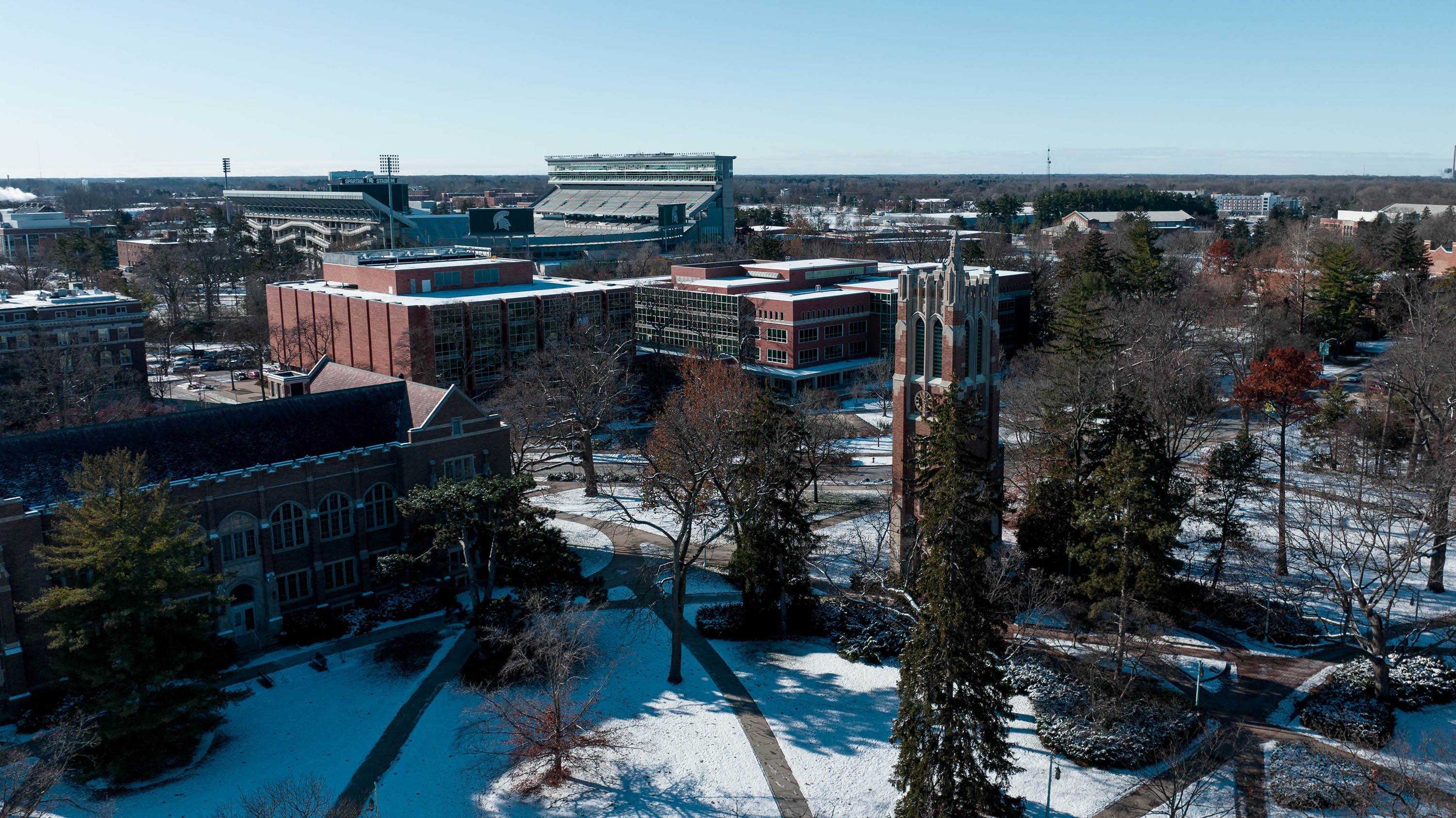 Birds-eye view of Beaumont Tower and Spartan Stadium in the snow