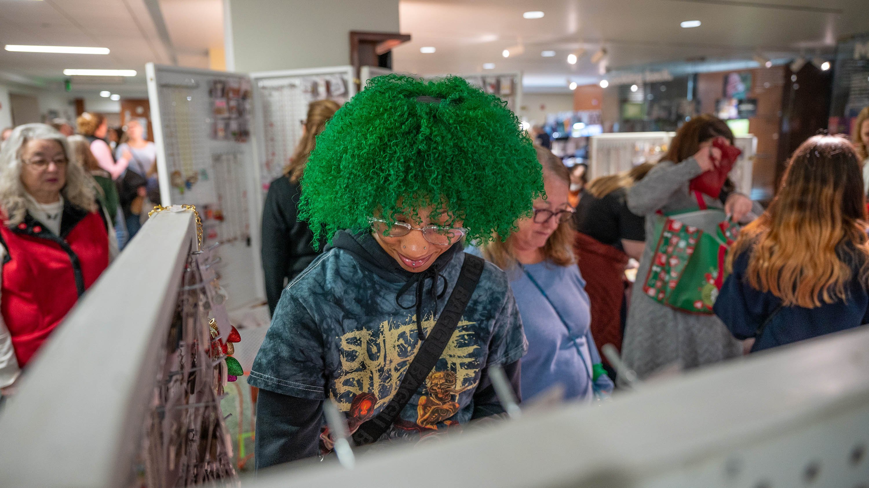 Person looking at booth in Arts and Crafts show