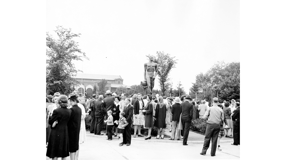 A crowd mingles shortly after the unveiling of the Spartan Statue on June 9, 1945.