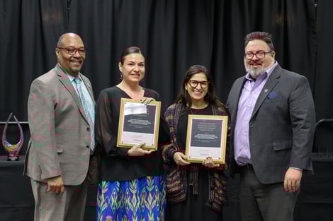 Estrella Torrez posing with award at the Outreach Awards ceremony