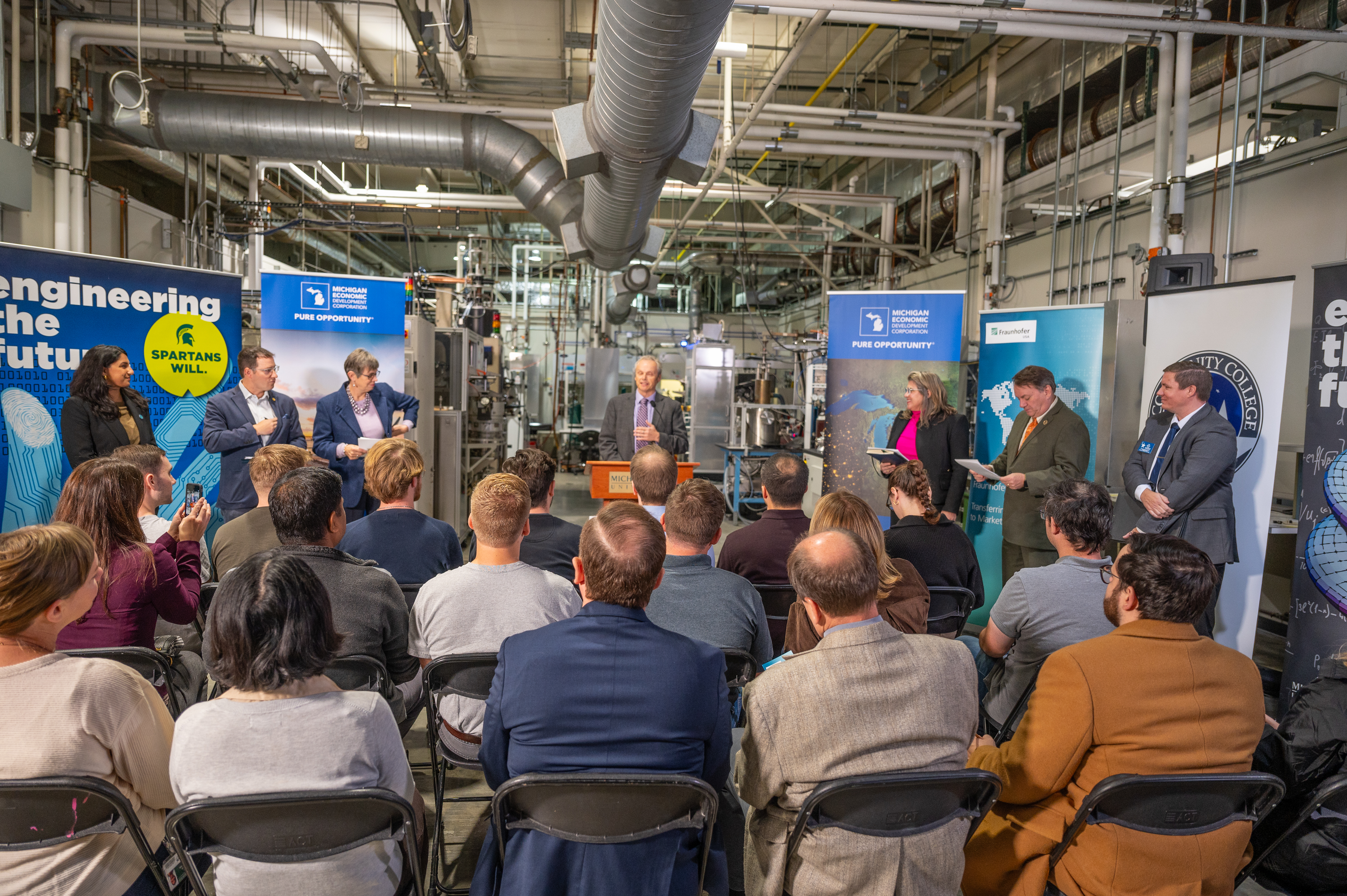 Official addresses audience at an event for semiconductor grant funds.