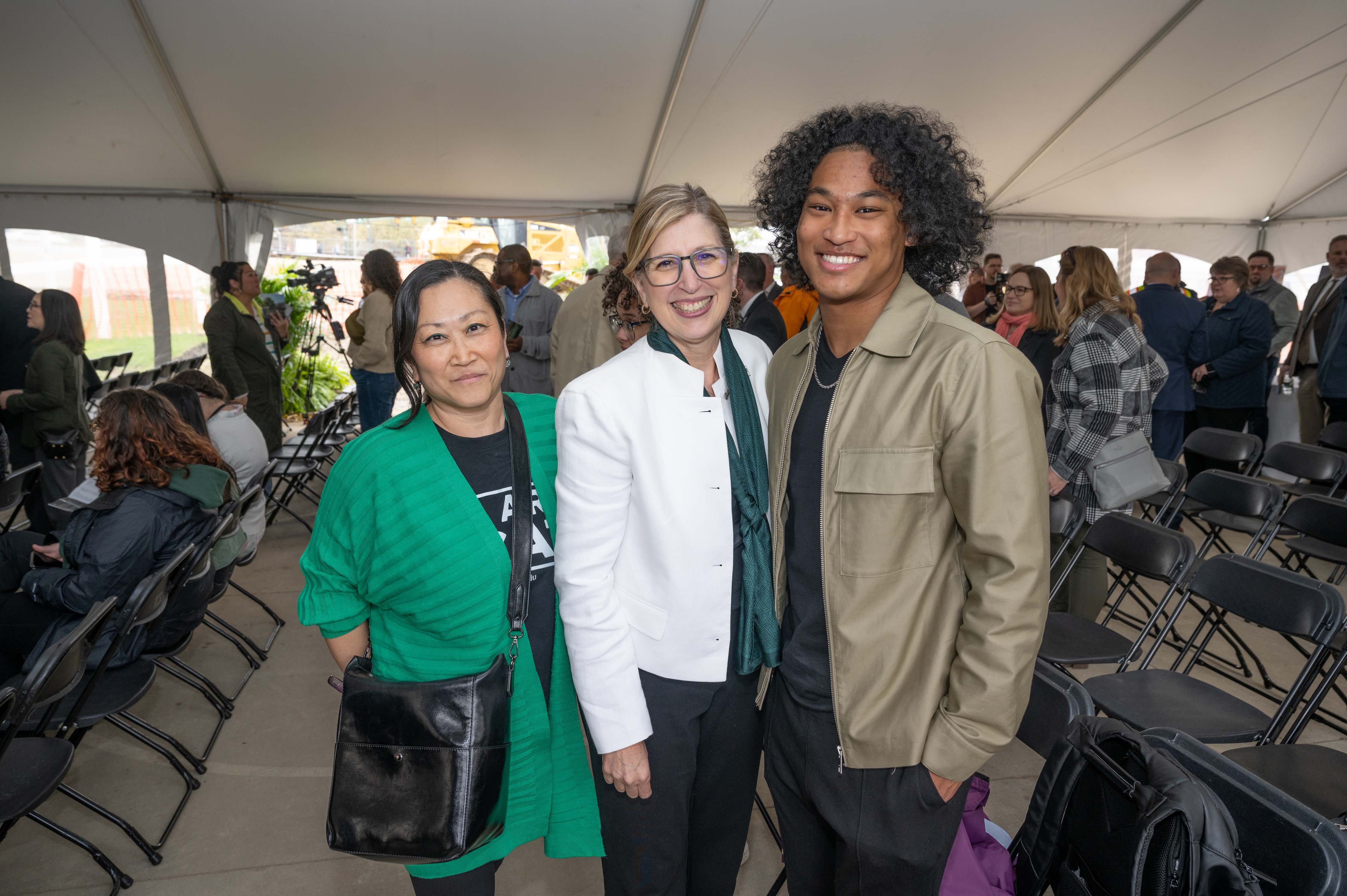 Interim President Teresa K. Woodruff poses with Megan Kozar and Jai Kozar-Lewis at the multicultural center groundbreaking. Photo by Derrick L. Turner.