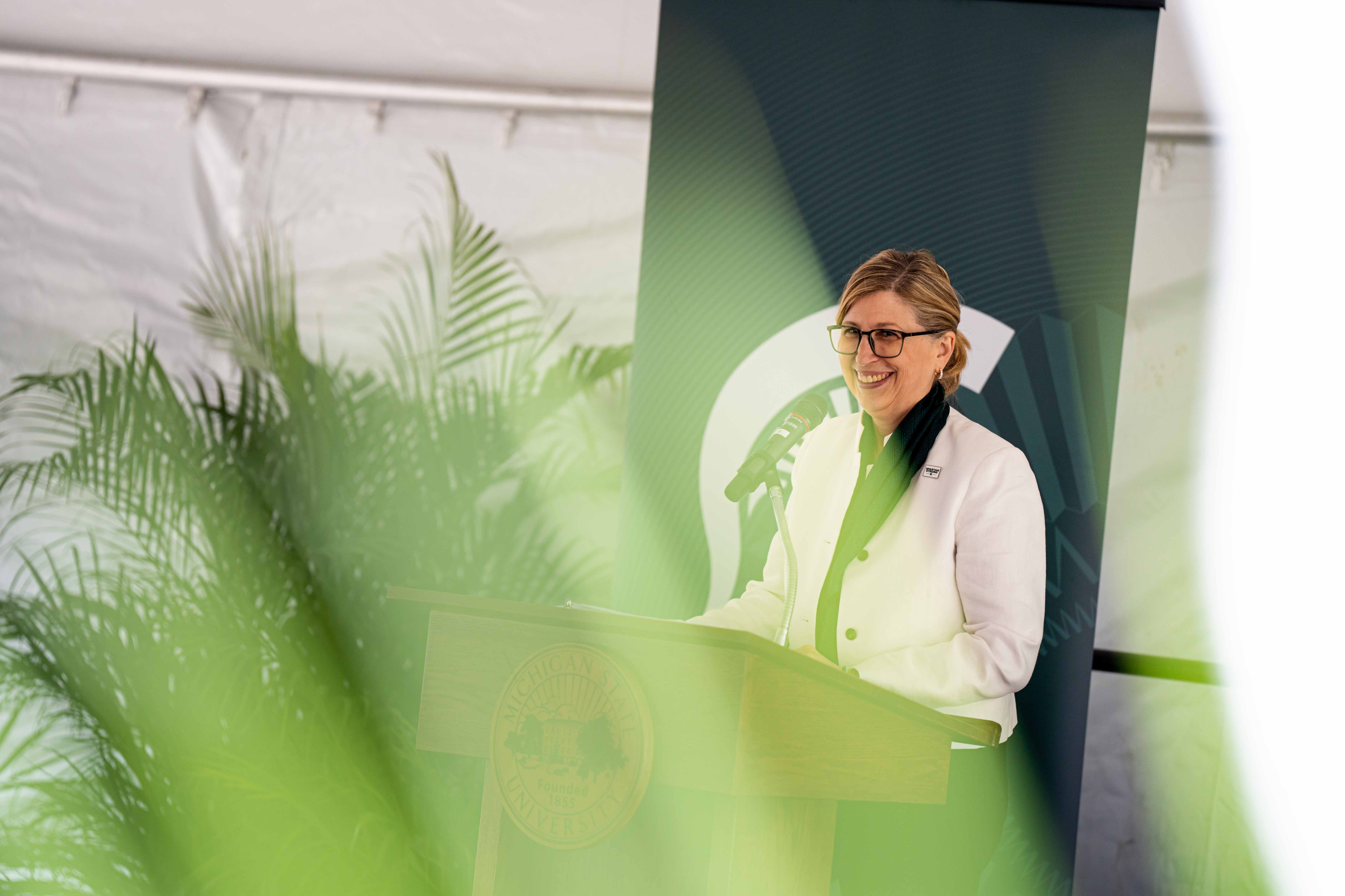 Interim President Teresa K. Woodruff provides welcome remarks at the multicultural center groundbreaking ceremony. Photograph by Nick Schrader.
