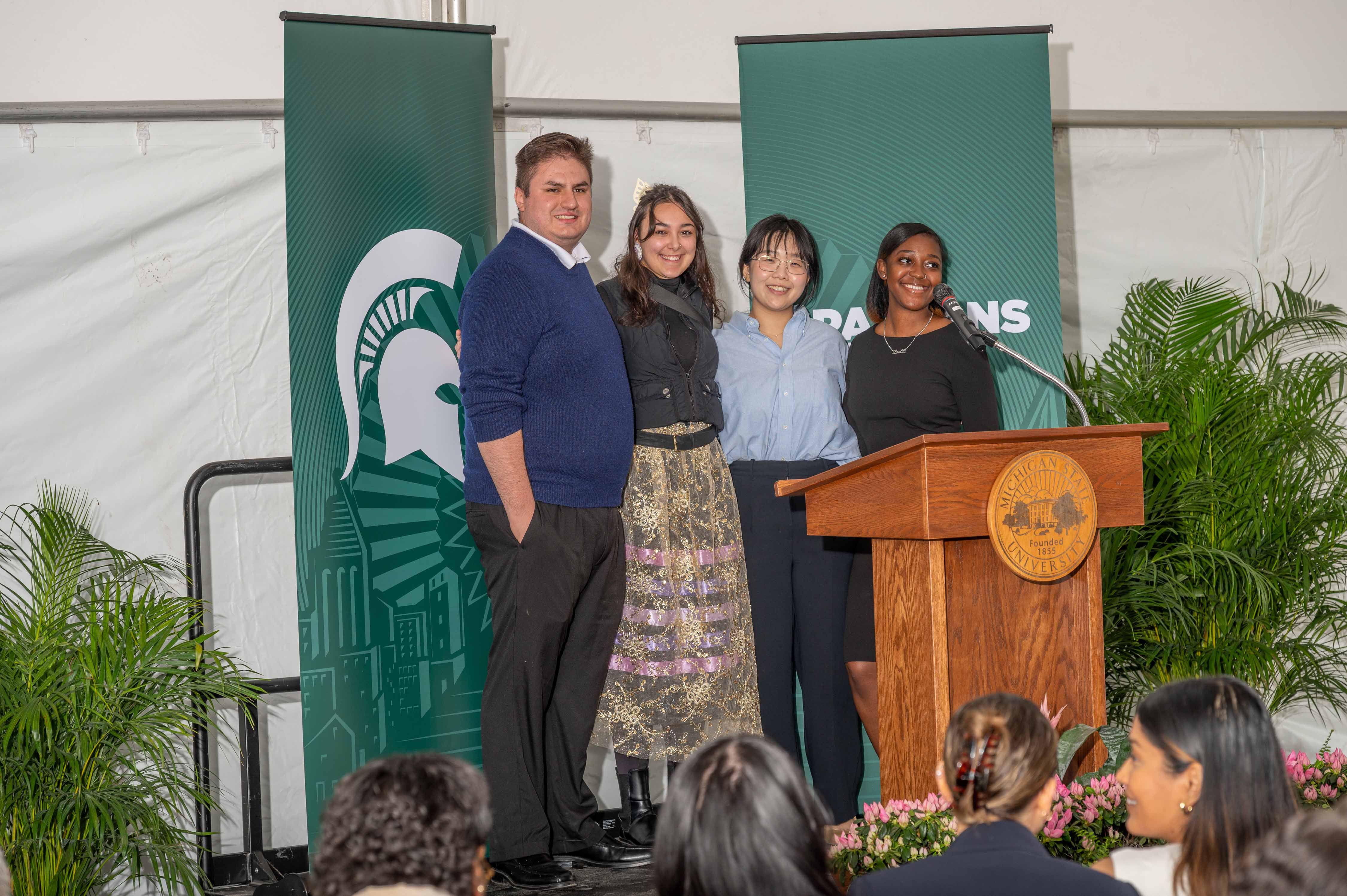 George Ramirez-Madrigal, Neely Bardwell, Sujin Lee and Drue Bender guide the audience through the libations and land acknowledgment portion of the program. Photo by Derrick L. Turner.