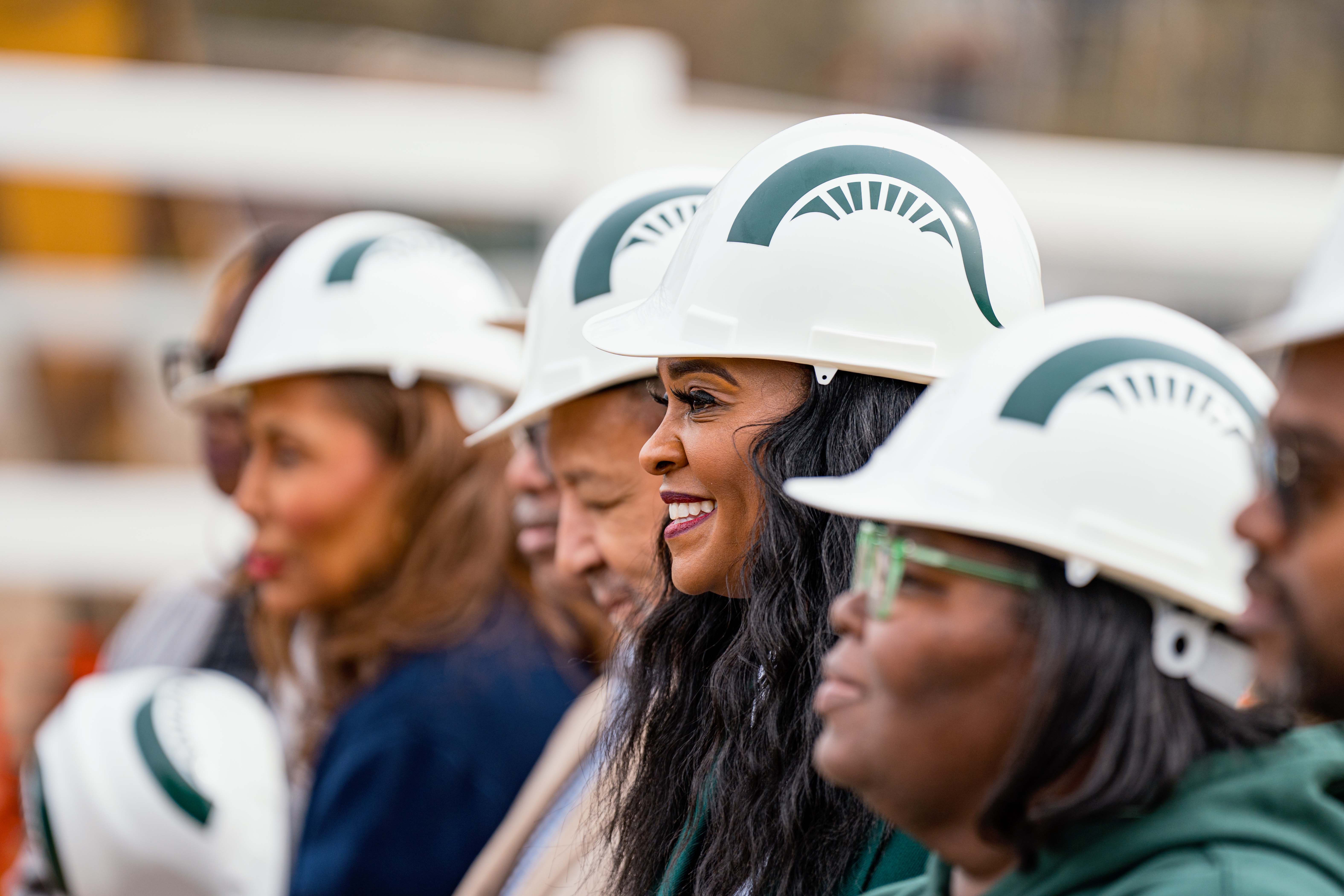 Participants get ready for a groundbreaking ceremony photo. Photograph by Nick Schrader.