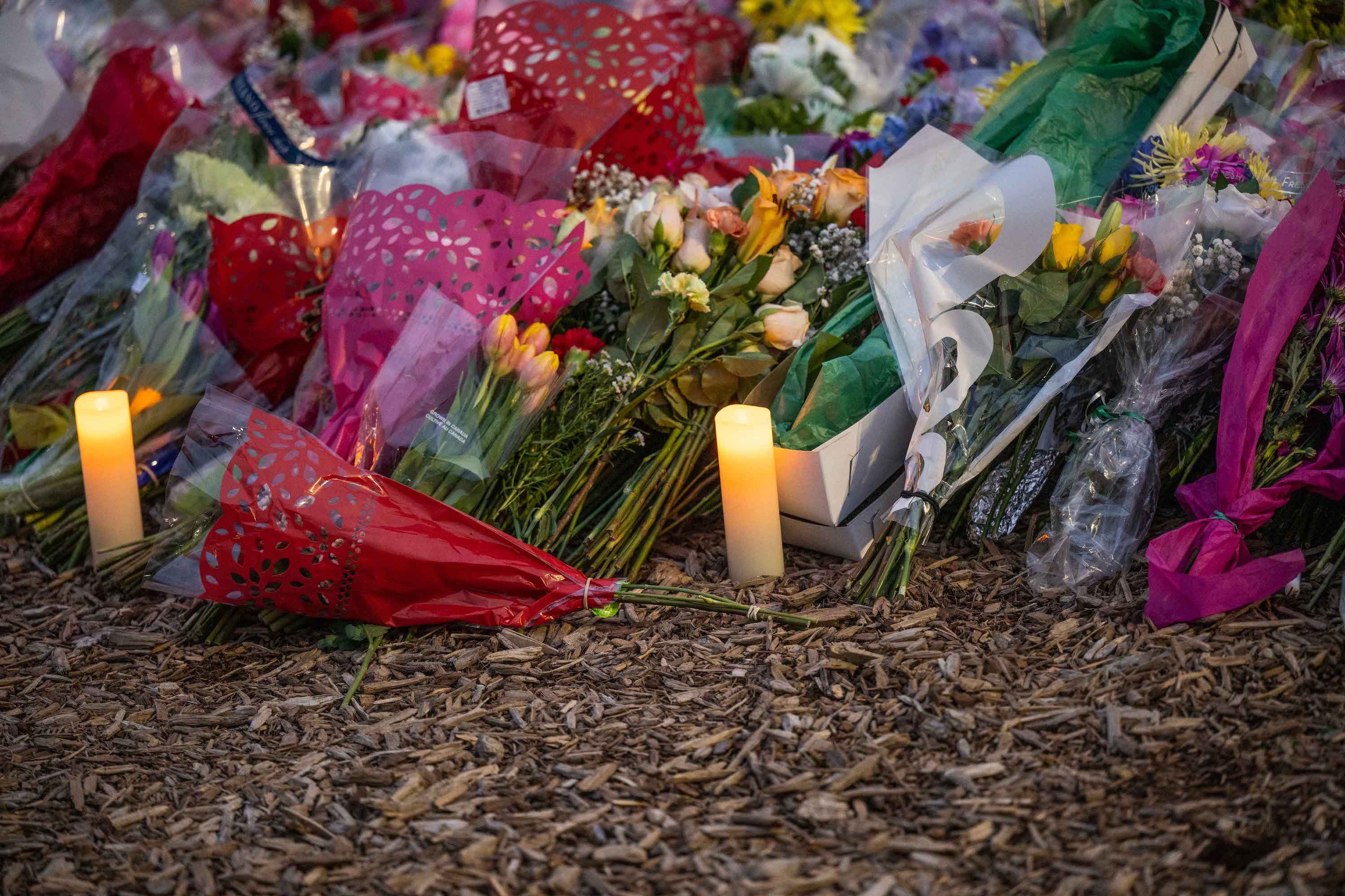 Candles and flowers near The Rock.