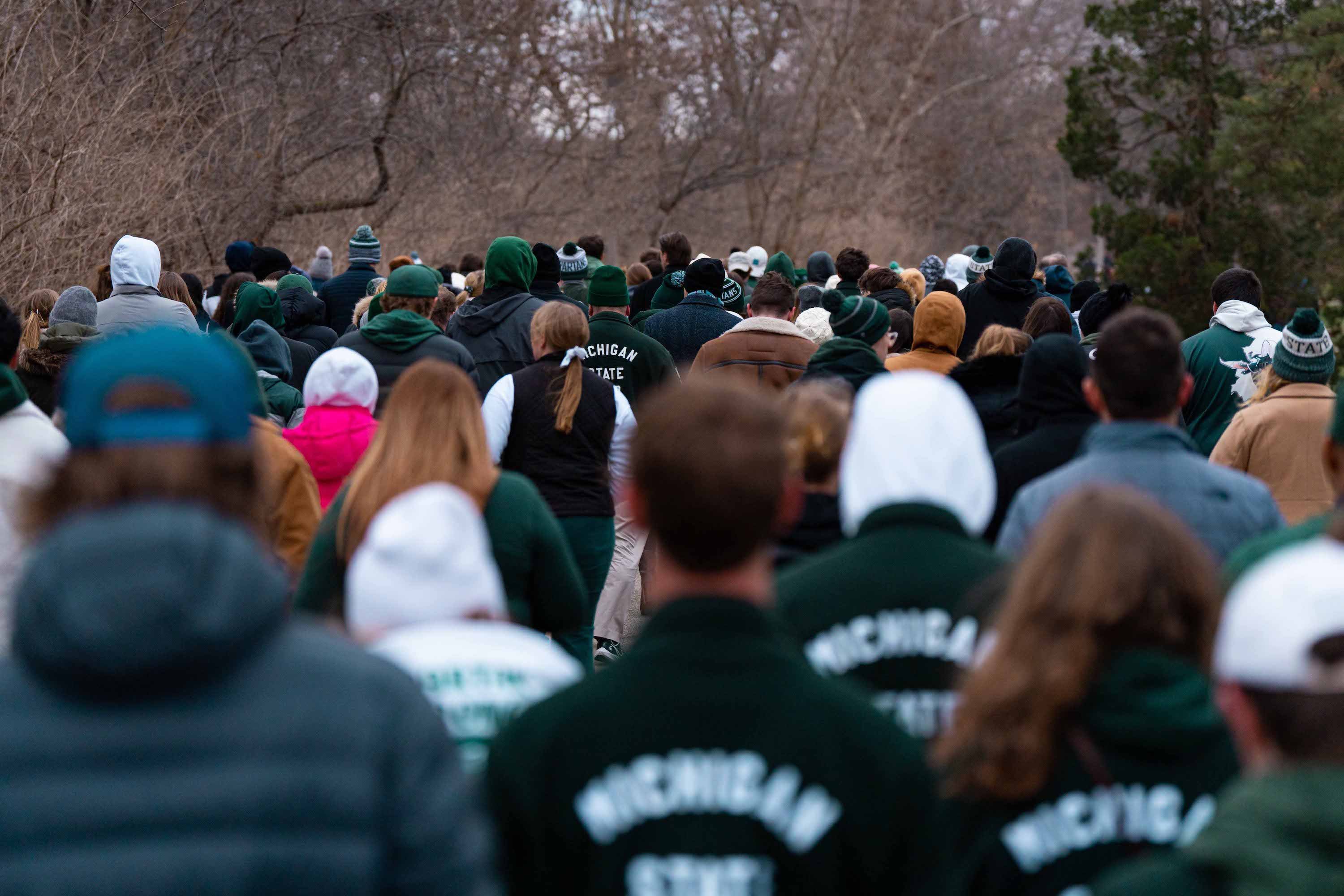 A group of Spartans walks to the vigil.