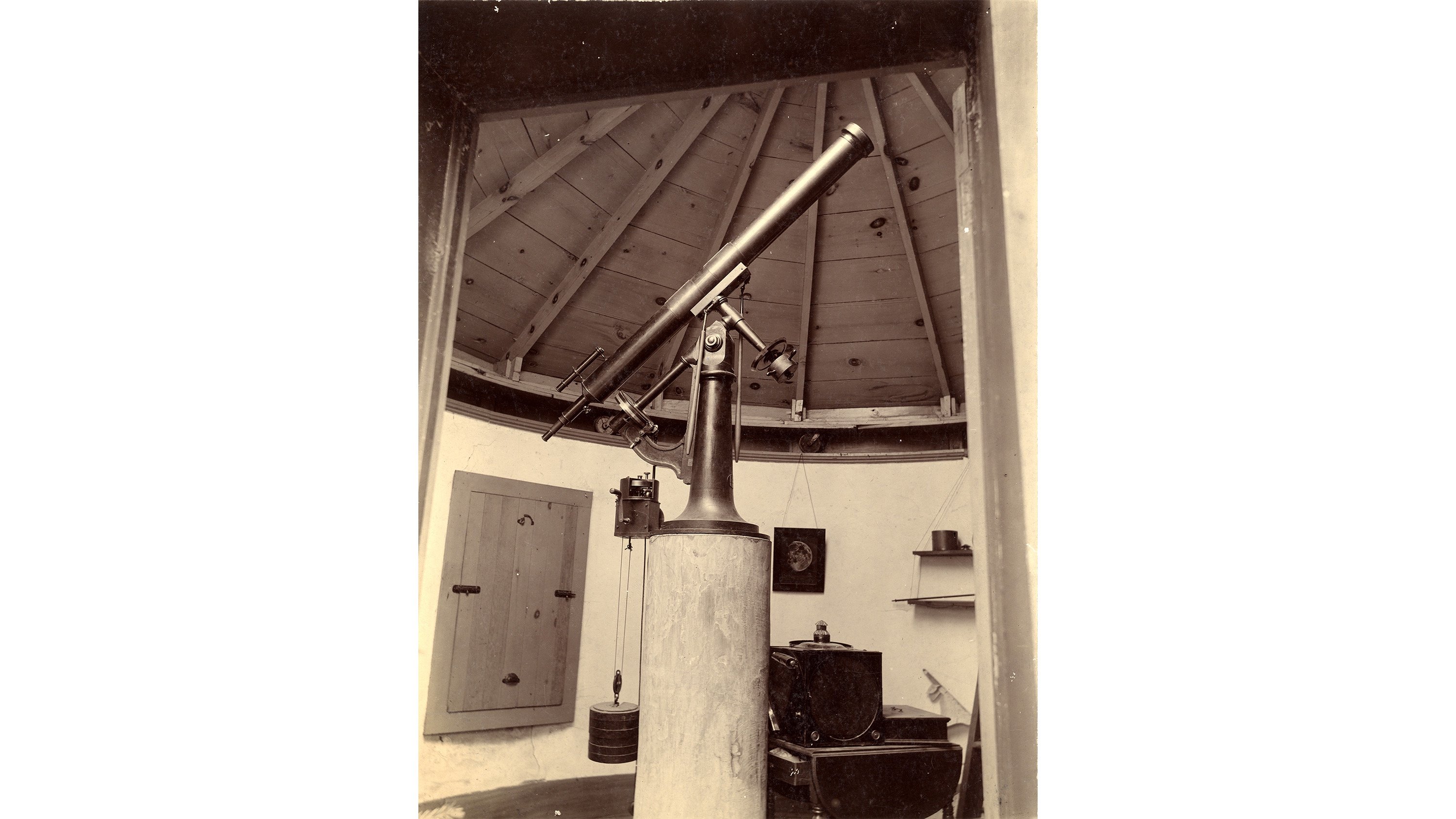 A sepia-toned photo of a telescope