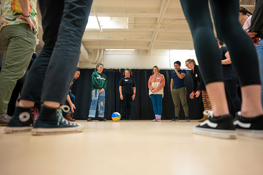 TIna M. Newhauser and MSU students participate in an activity with a beach ball during an intimacy direction workshop.