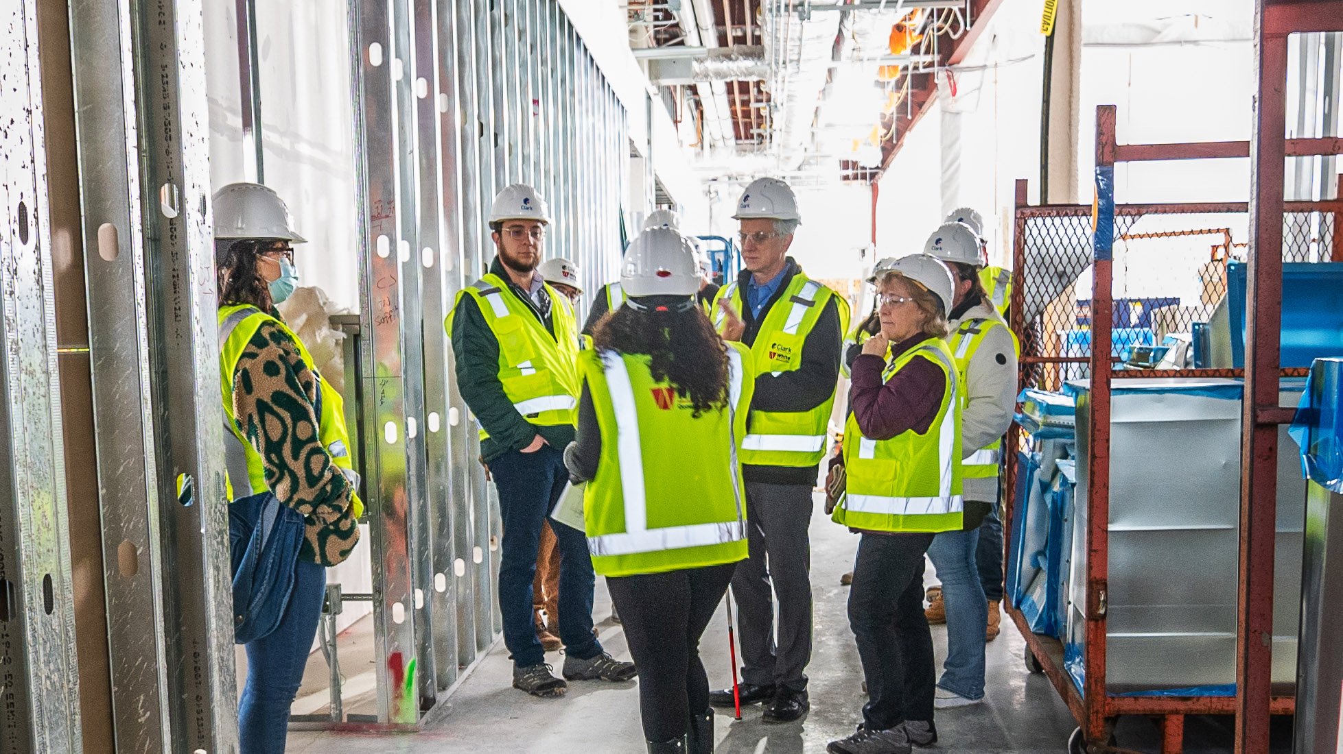 People on tour of multicultural center construction site