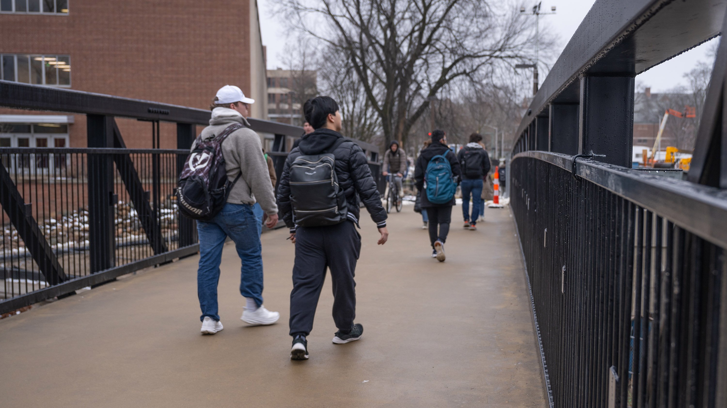 Students crossing pedestrian bridge