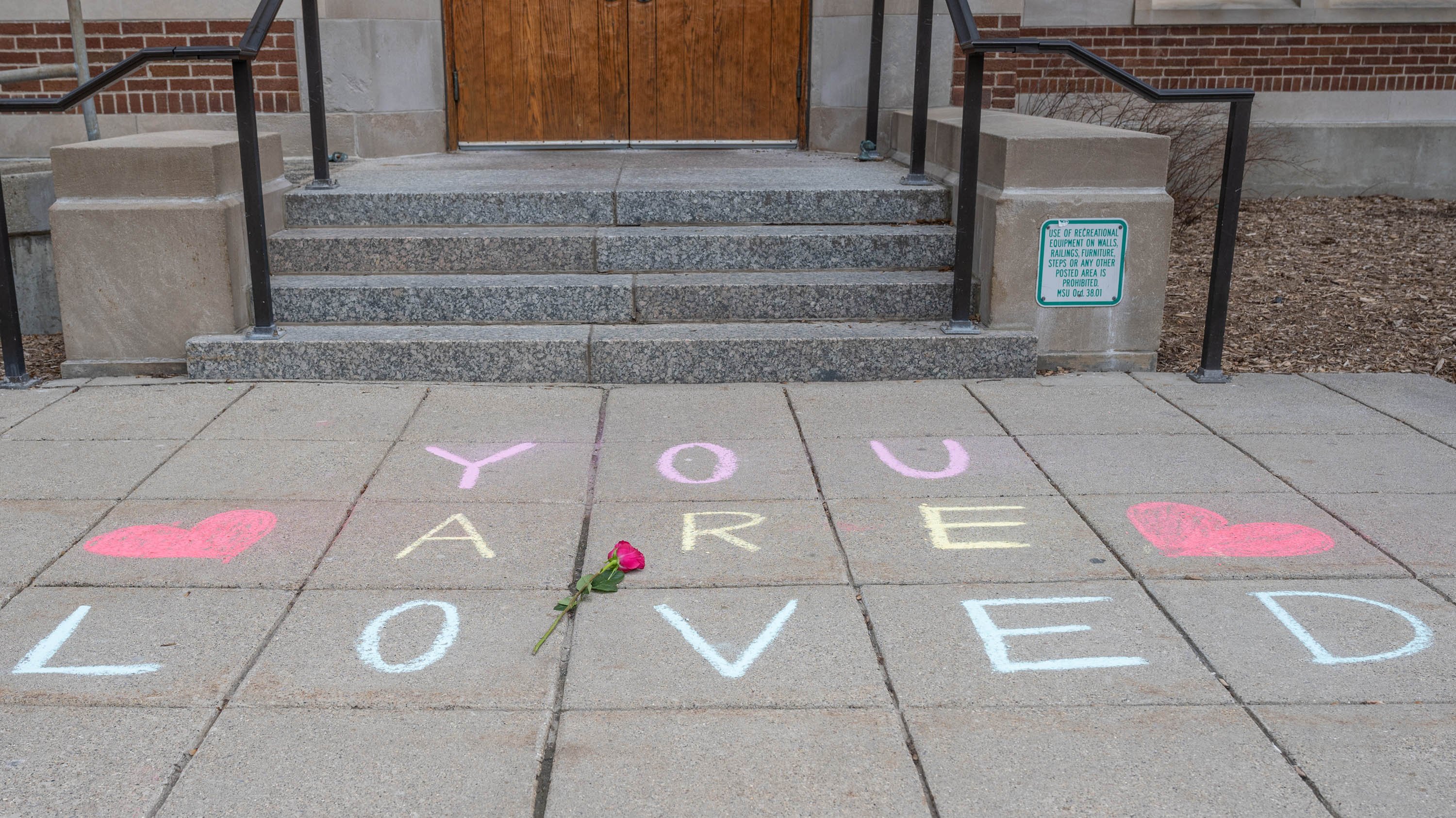 Sidewalk chalk reading 'you are loved' in front of Berkey Hall
