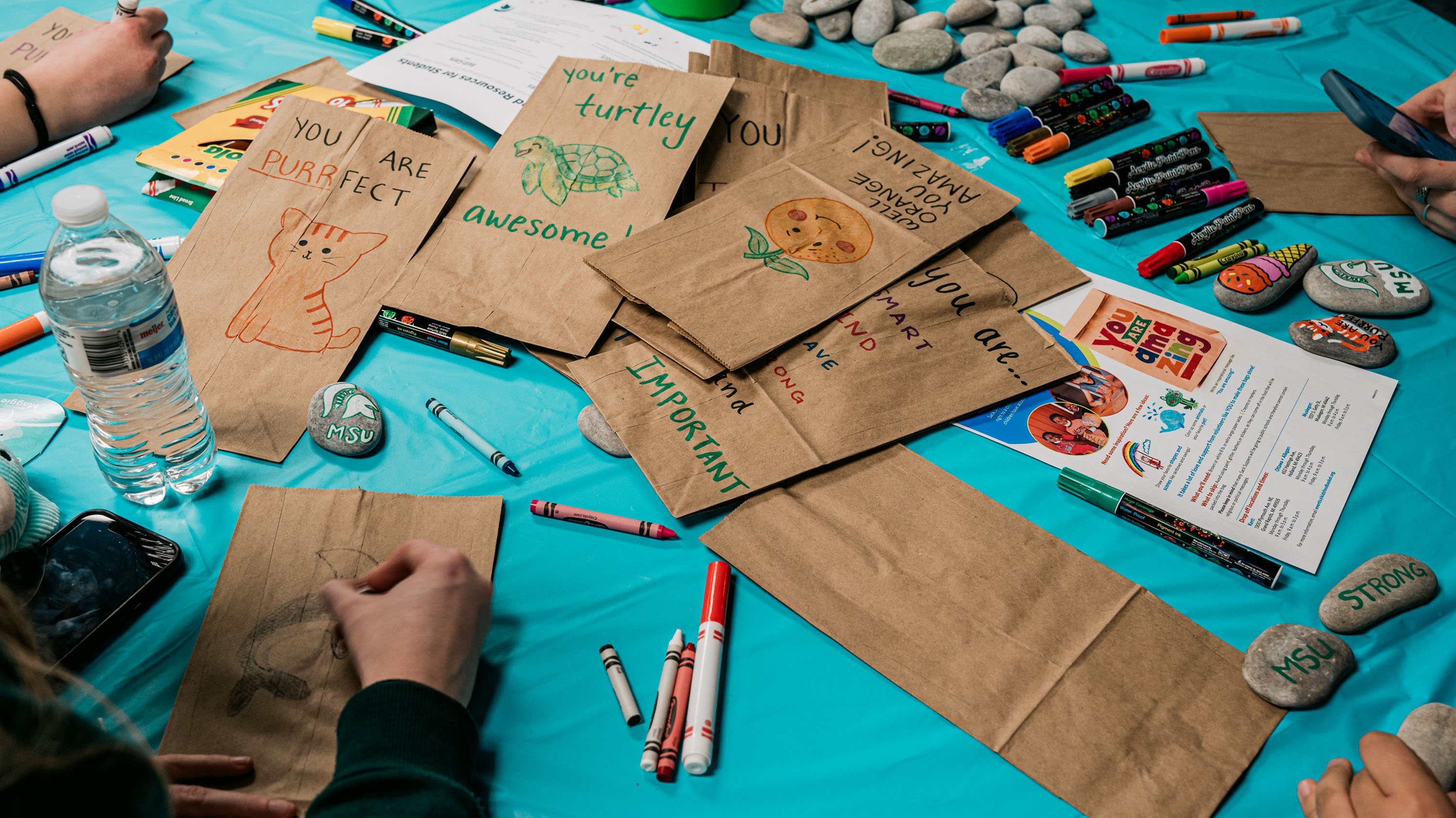Decorated brown paper bags at healing through kindness event