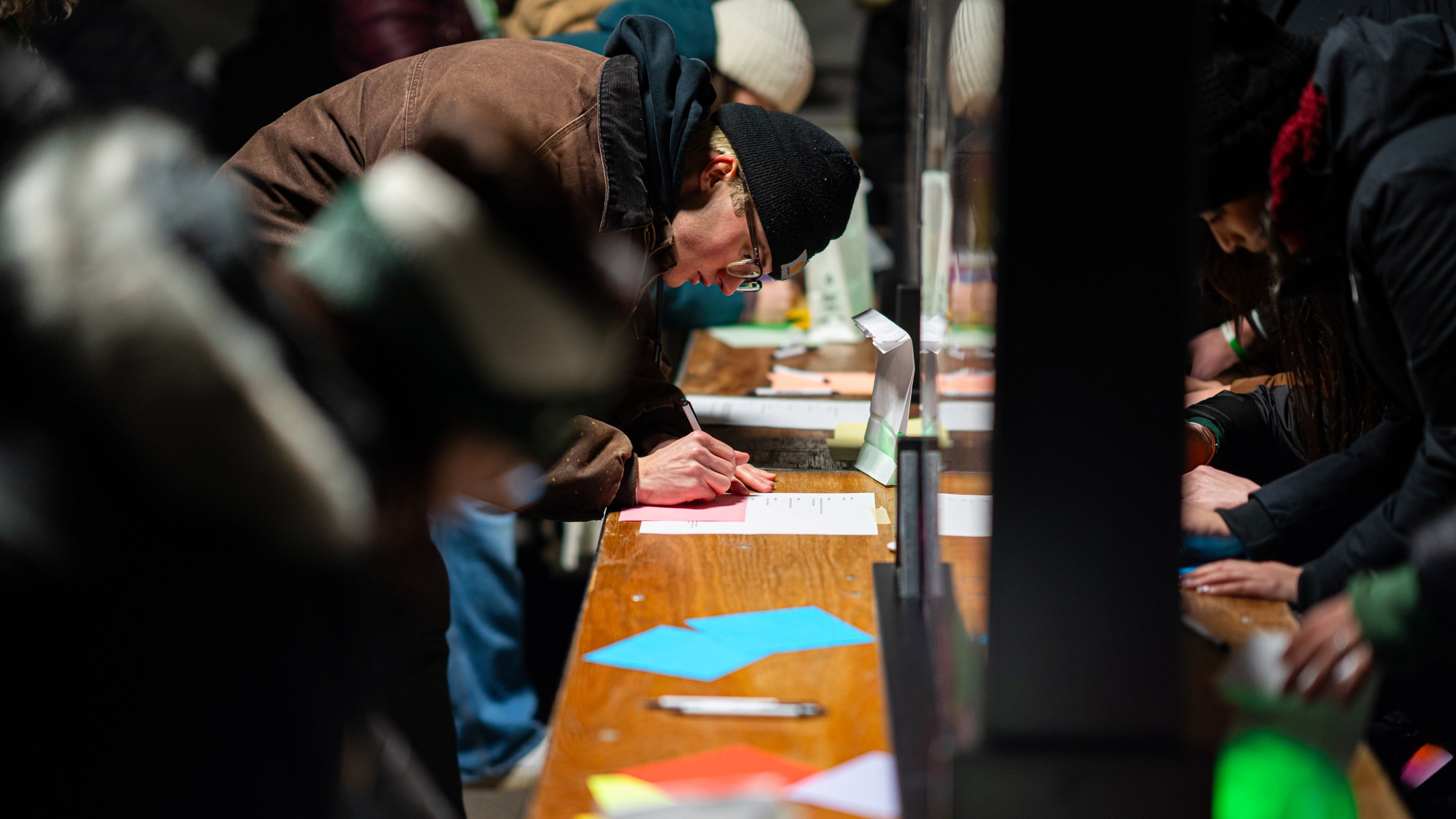 Members of MSU community writing notes at remembrance gathering