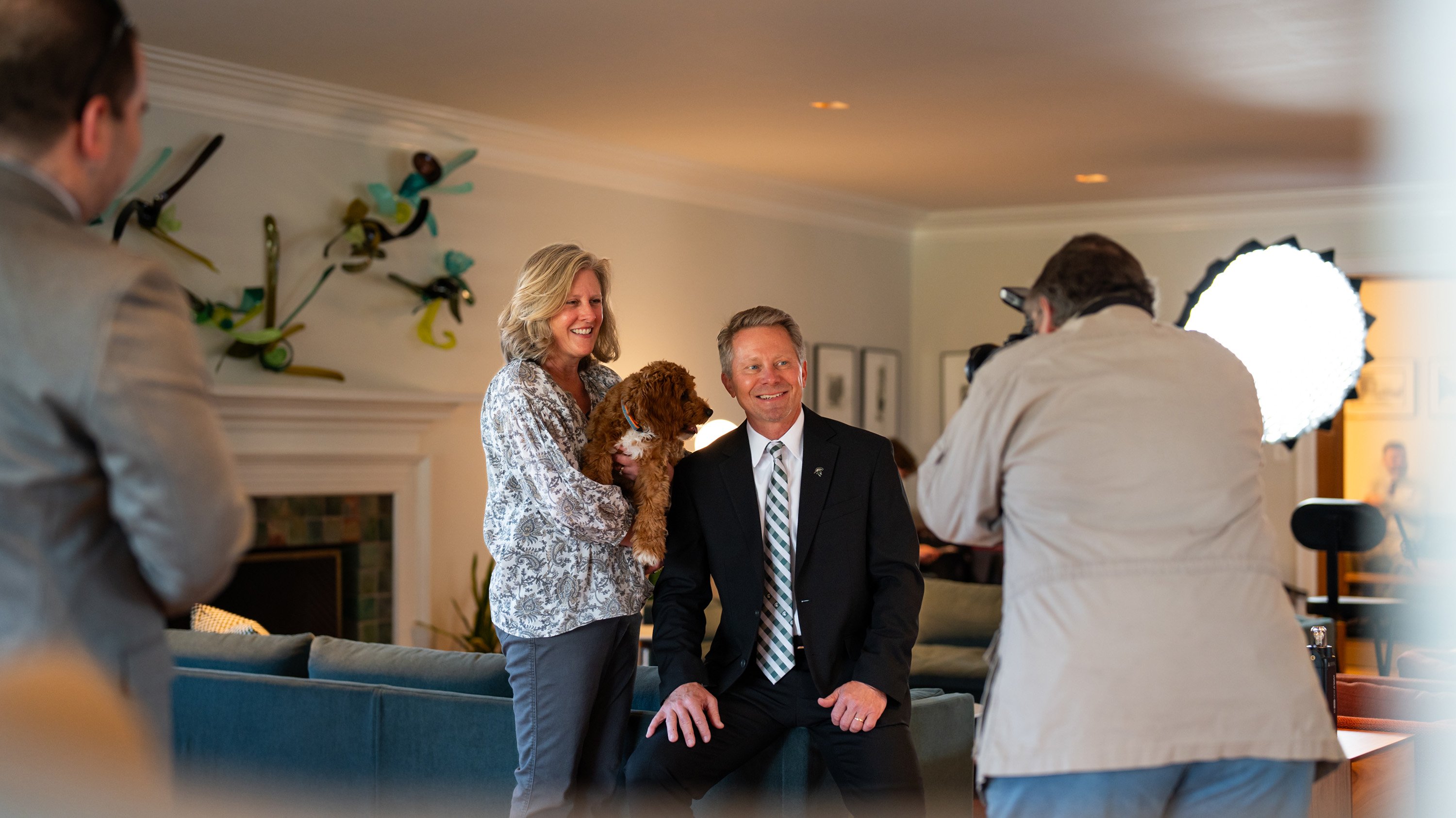 Amy and Kevin M. Guskiewicz and dog Koda posing for photo