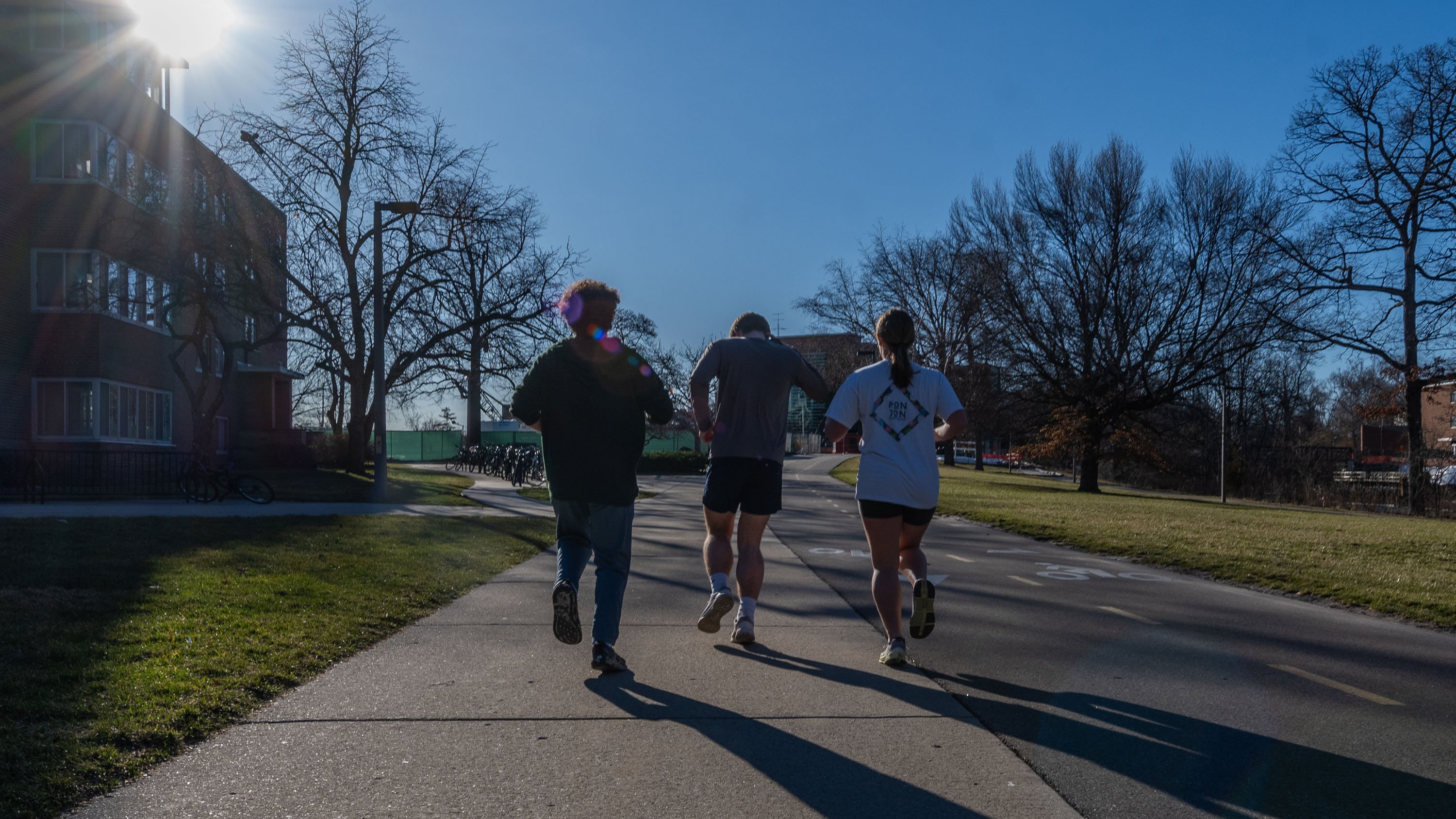 Students running on campus trail