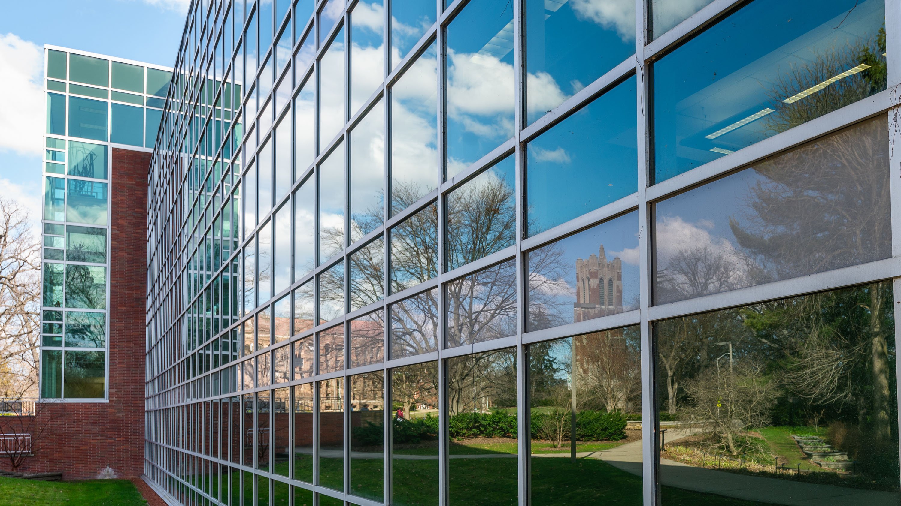 Reflection of Beaumont Tower in library windows