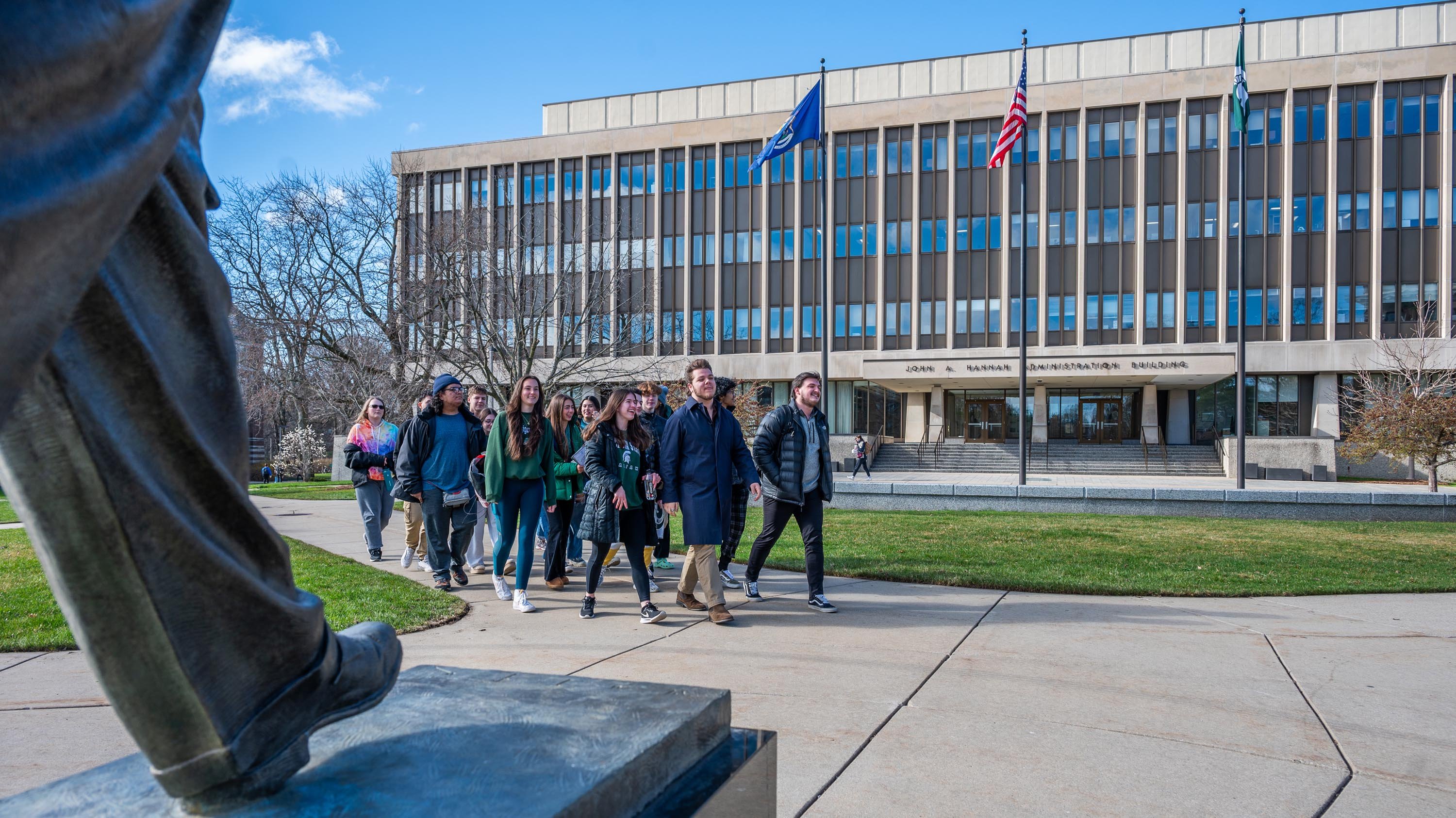 Admitted students and families walking past Hannah Admin building