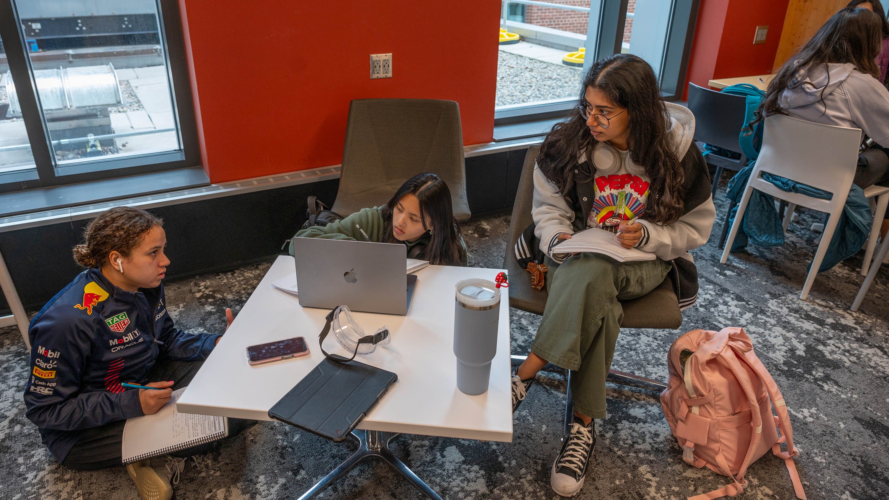 Three students studying in STEM building