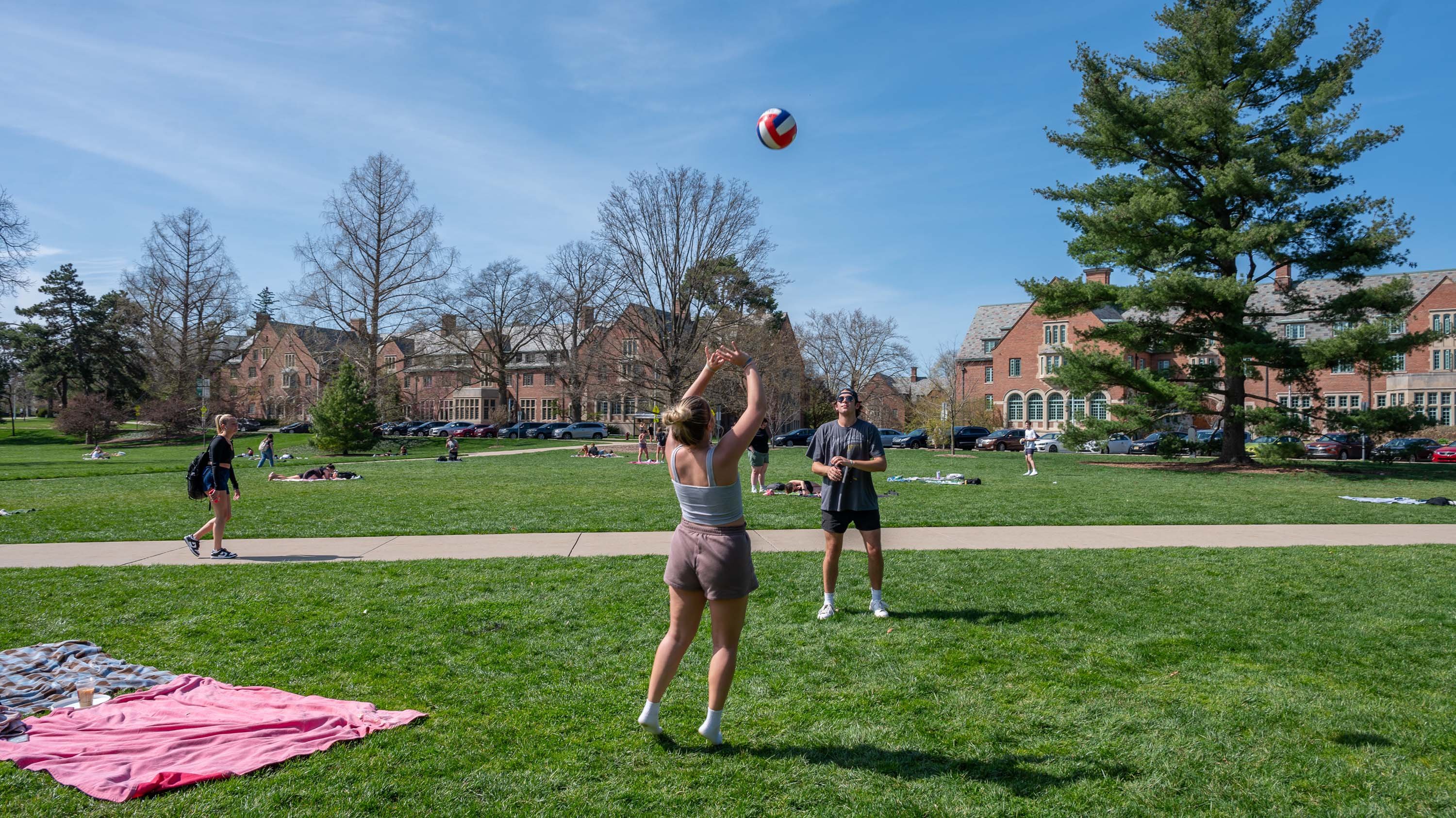 Students playing volleyball in Adams Field